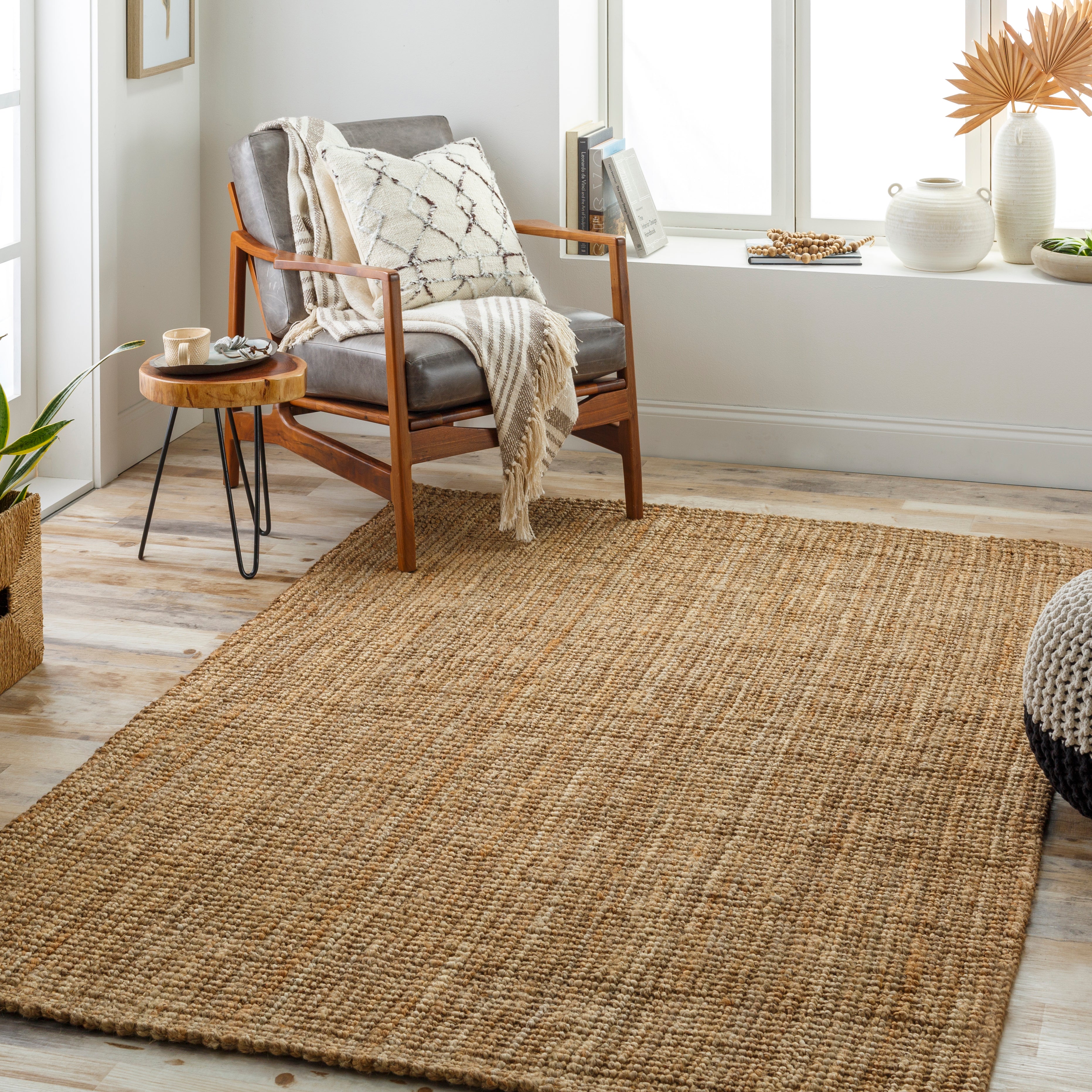 Featuring Becki Owens x Surya Calla Tan/Beige Rug by Surya at Amethyst Home. Introducing the perfect combination of style and comfort: Becki Owens x Surya's Calla Rug. Crafted with natural jute fibers and accented with a subtle tan and beige design, this rug adds an inviting, cozy touch to any living space.
100% JuteHand Woven No PileThickness: 0.3"Colo. Amethyst Home provides interior design, new home construction design consulting, vintage area rugs, and lighting in the Winter Garden metro area.