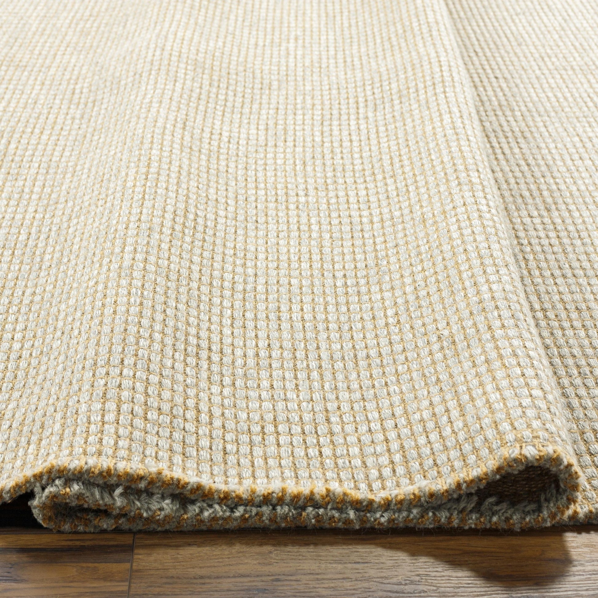 Introducing the Kimi area rug! This stunning and unique piece of art was designed in collaboration between Surya and Becki Owens, two creative minds coming together to create something special. The Kimi rug features a beautiful stitched design, with a textural woven pattern and self tassels that make it a one-of-a-kind addition to any space. Amethyst Home provides interior design, new home construction design consulting, vintage area rugs, and lighting in the Austin metro area.