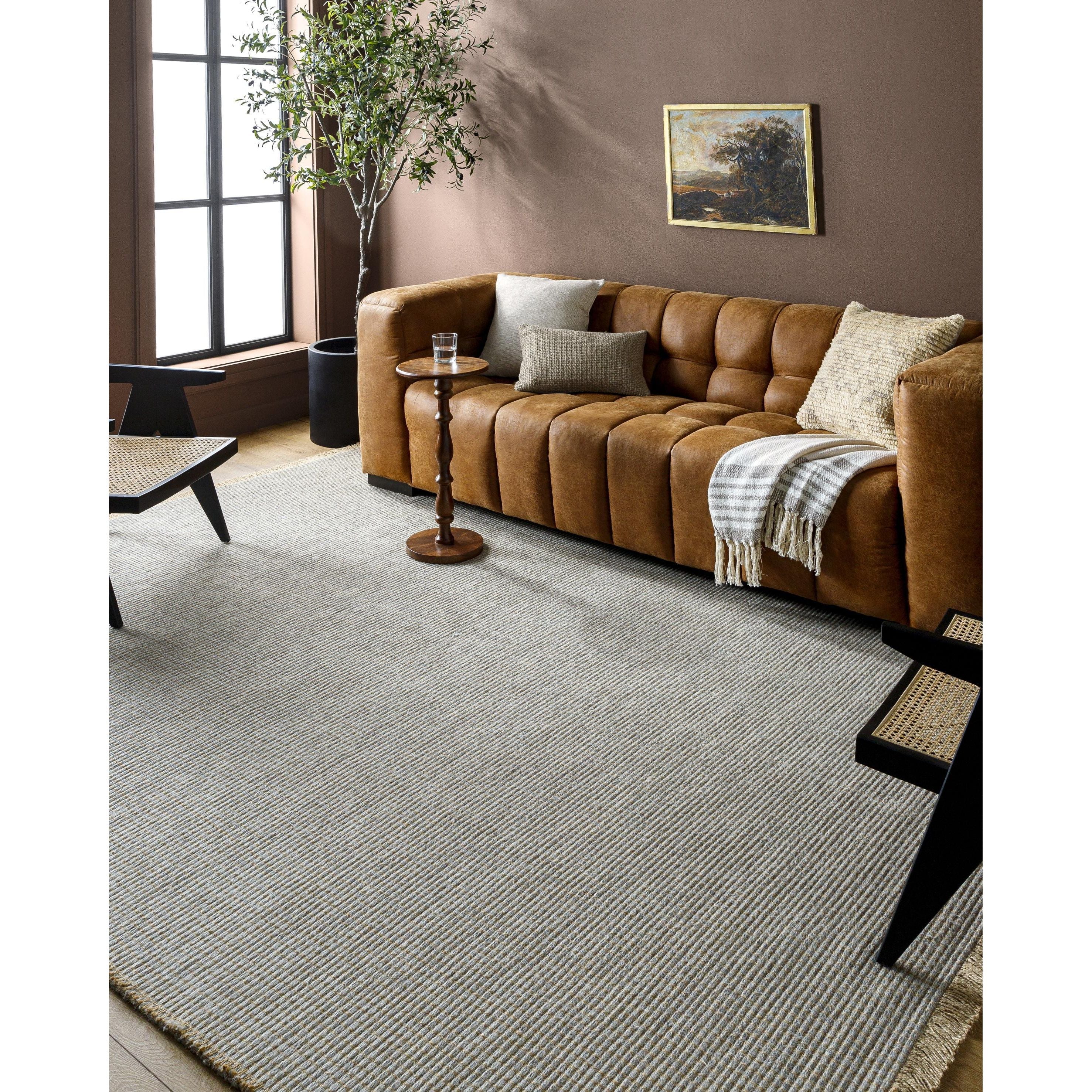 Introducing the Kimi area rug! This stunning and unique piece of art was designed in collaboration between Surya and Becki Owens, two creative minds coming together to create something special. The Kimi rug features a beautiful stitched design, with a textural woven pattern and self tassels that make it a one-of-a-kind addition to any space. Amethyst Home provides interior design, new home construction design consulting, vintage area rugs, and lighting in the Austin metro area.