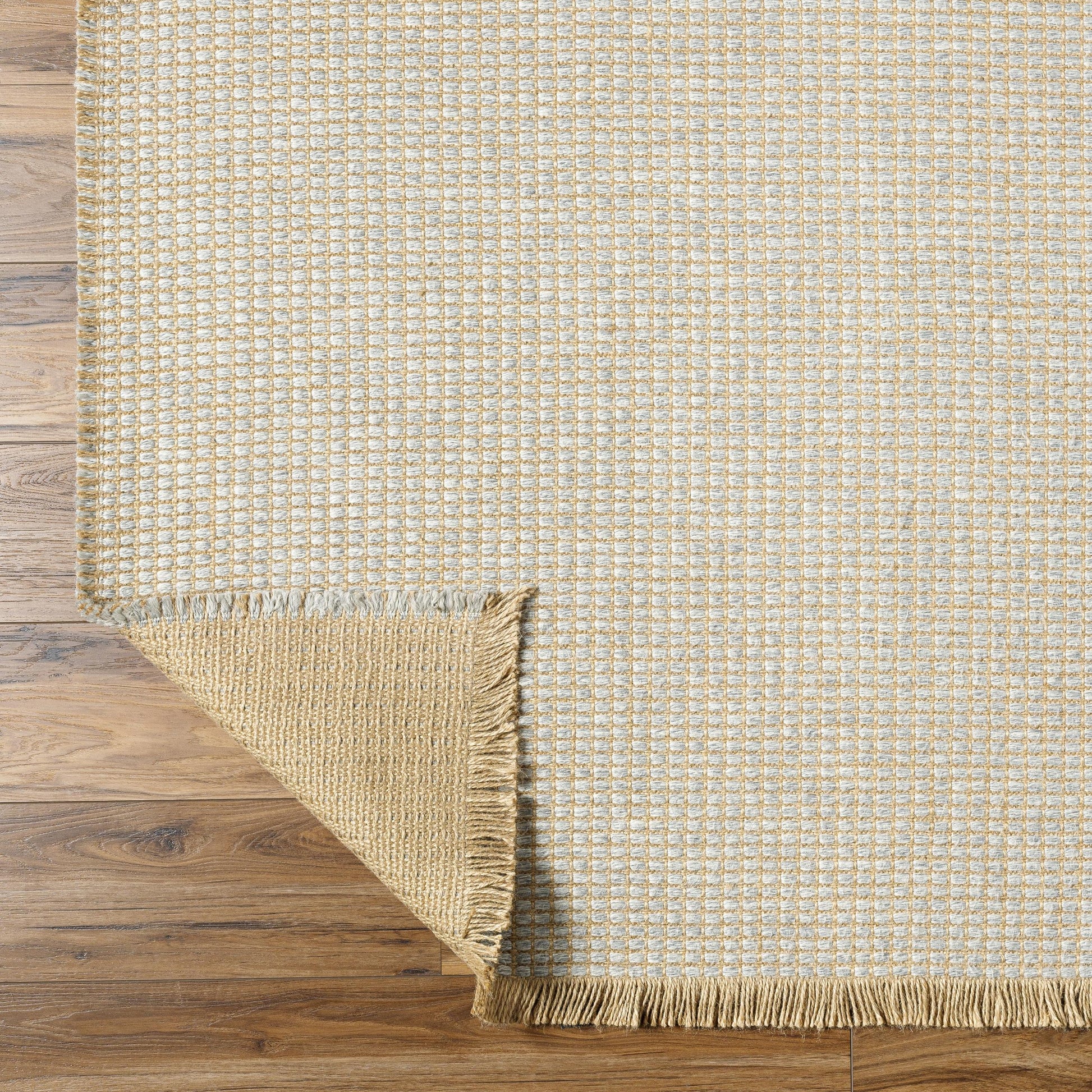 Introducing the Kimi area rug! This stunning and unique piece of art was designed in collaboration between Surya and Becki Owens, two creative minds coming together to create something special. The Kimi rug features a beautiful stitched design, with a textural woven pattern and self tassels that make it a one-of-a-kind addition to any space. Amethyst Home provides interior design, new home construction design consulting, vintage area rugs, and lighting in the Miami metro area.