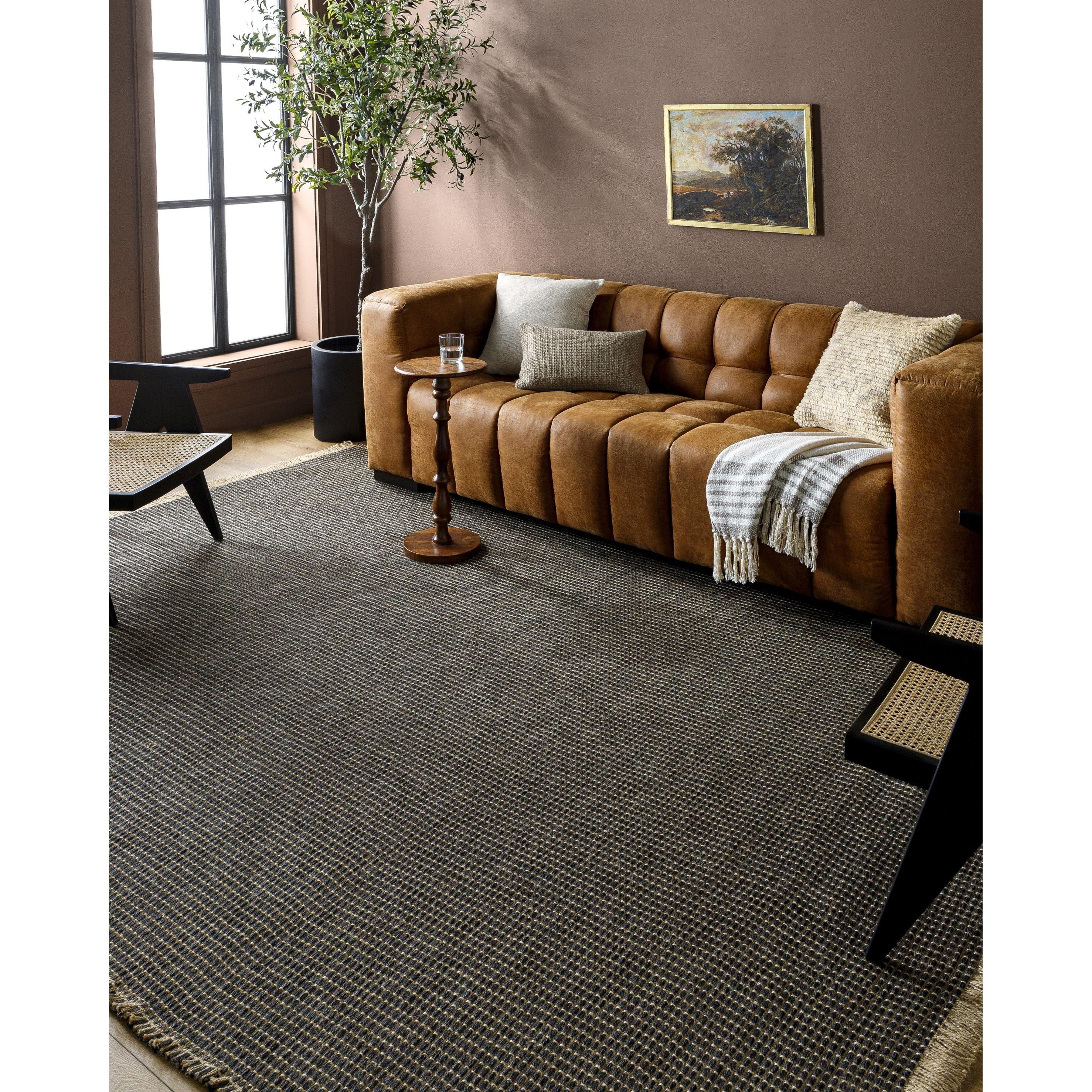 This beautiful Kimi area rug is the perfect addition to any room in your home. The special collaboration between Surya and Becki Owens has created a unique, eye-catching design that will bring texture and style to your space. The rug is made from polypropylene and jute, creating a textural woven pattern in natural tones with dark contrast. Amethyst Home provides interior design, new home construction design consulting, vintage area rugs, and lighting in the Omaha metro area.