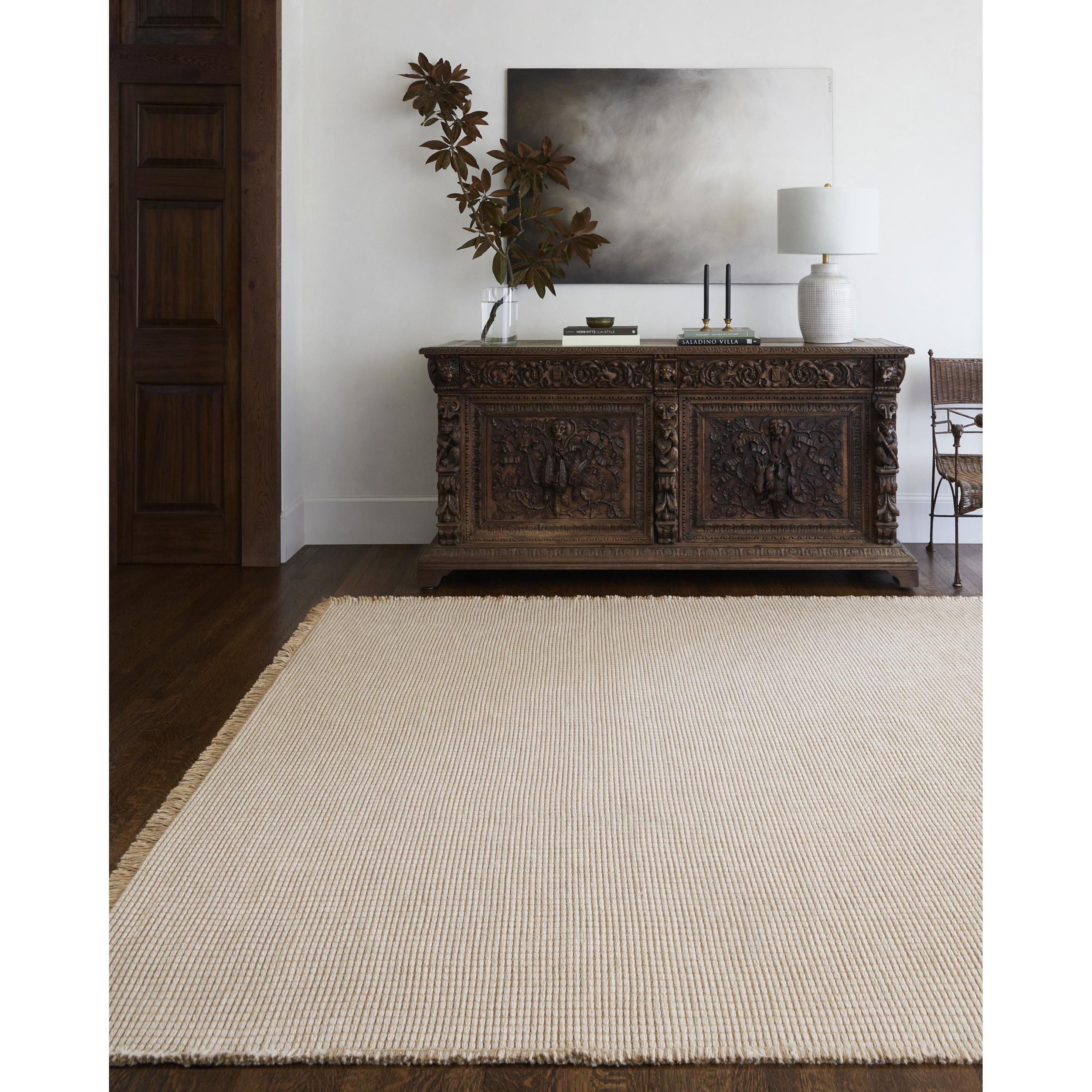 Featuring Becki Owens x Surya Kimi Light Beige Rug by Surya at Amethyst Home. This unique and exquisite Kimi area rug is a special collaboration piece from our Becki Owens x Surya line. The perfect addition to any space, this beautiful rug features a unique stitched design made of polypropylene and jute. Its main colors of natural and beige add a textural woven. Amethyst Home provides interior design, new home construction design consulting, vintage area rugs, and lighting in the Omaha metro area.