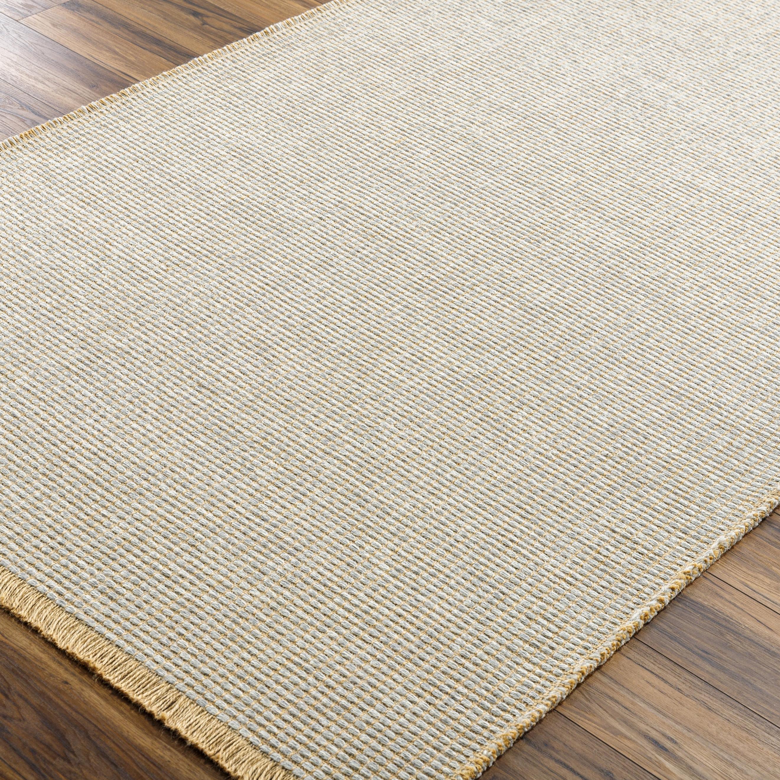 Introducing the Kimi area rug! This stunning and unique piece of art was designed in collaboration between Surya and Becki Owens, two creative minds coming together to create something special. The Kimi rug features a beautiful stitched design, with a textural woven pattern and self tassels that make it a one-of-a-kind addition to any space. Amethyst Home provides interior design, new home construction design consulting, vintage area rugs, and lighting in the Tampa metro area.