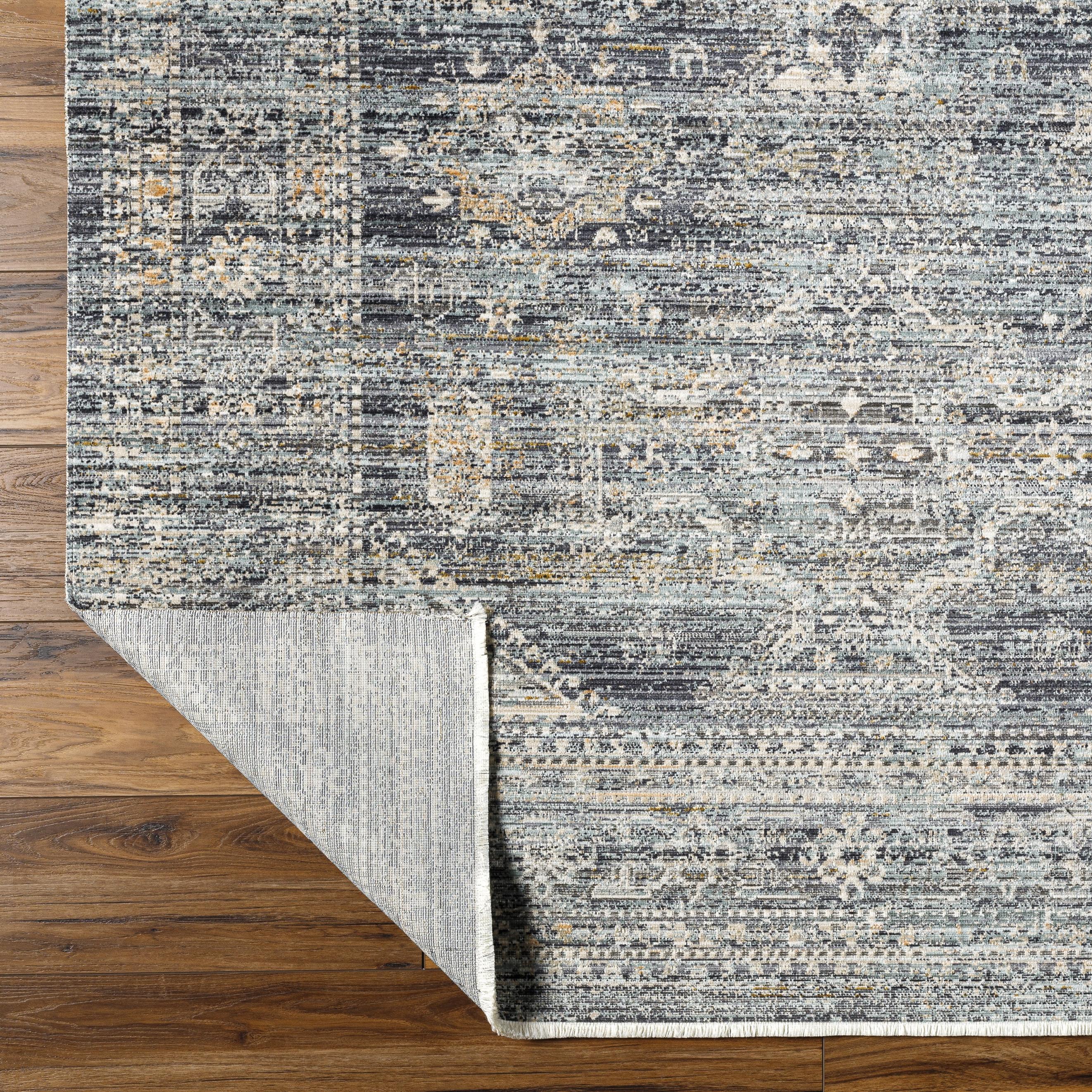 Introducing the Margaret area rug, a unique and special collaboration piece between Surya and Becki Owens. Let this beautiful style be the centerpiece of your space, with a captivating design that brings a timeless, old-age feel. Amethyst Home provides interior design, new home construction design consulting, vintage area rugs, and lighting in the Newport Beach metro area.