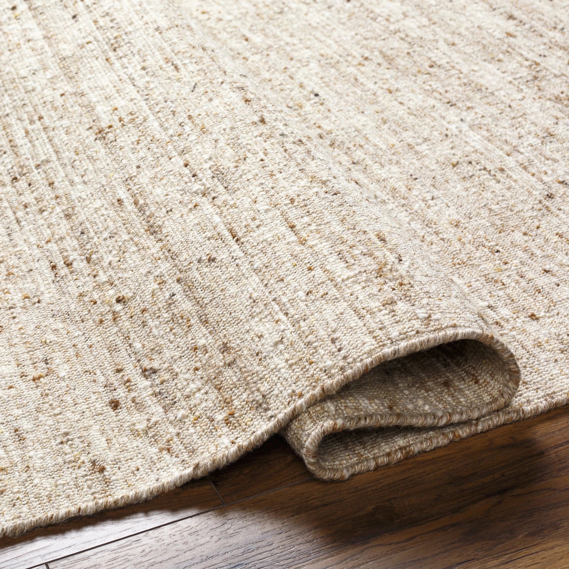 A modern, heathered warm beige look.  This is a great rug if you have other dominant design features in a space like a striking fireplace or standout patterns Amethyst Home provides interior design, new home construction design consulting, vintage area rugs, and lighting in the Nashville metro area.