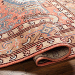 Experience the luxurious vintage vibes of the Kars Rug! With a rich warm color pallet featuring coral undertones, contrasting pale blue and tan details, and classic Moroccan inspired patterns, this timeless statement piece adds a unique touch to any room. Amethyst Home provides interior design, new construction, custom furniture, and area rugs in the Chicago metro area. KSA-2305