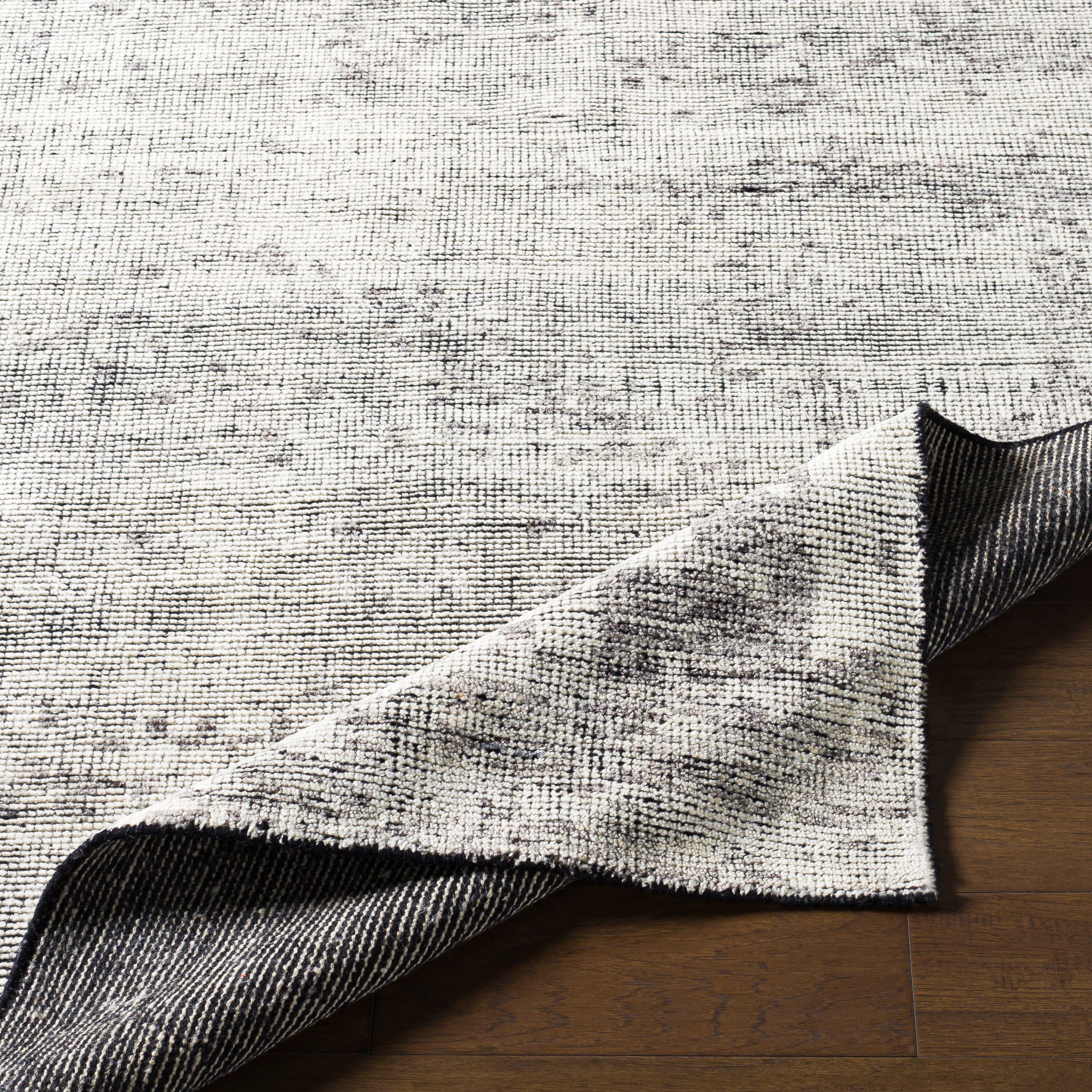 Featuring Malaga Archer Hand-Knotted Rug by Surya at Amethyst Home. The simplistic yet compelling rugs from the Malaga Archer effortlessly serve as the exemplar representation of modern decor. With their Hand-Knotted construction, these rugs provide a durability that can not be found in other handmade constructions, and boasts the ability to be thoroughly cleaned as it contains n. Amethyst Home provides interior design, new construction, custom furniture, and area rugs in the Des Moines metro area
