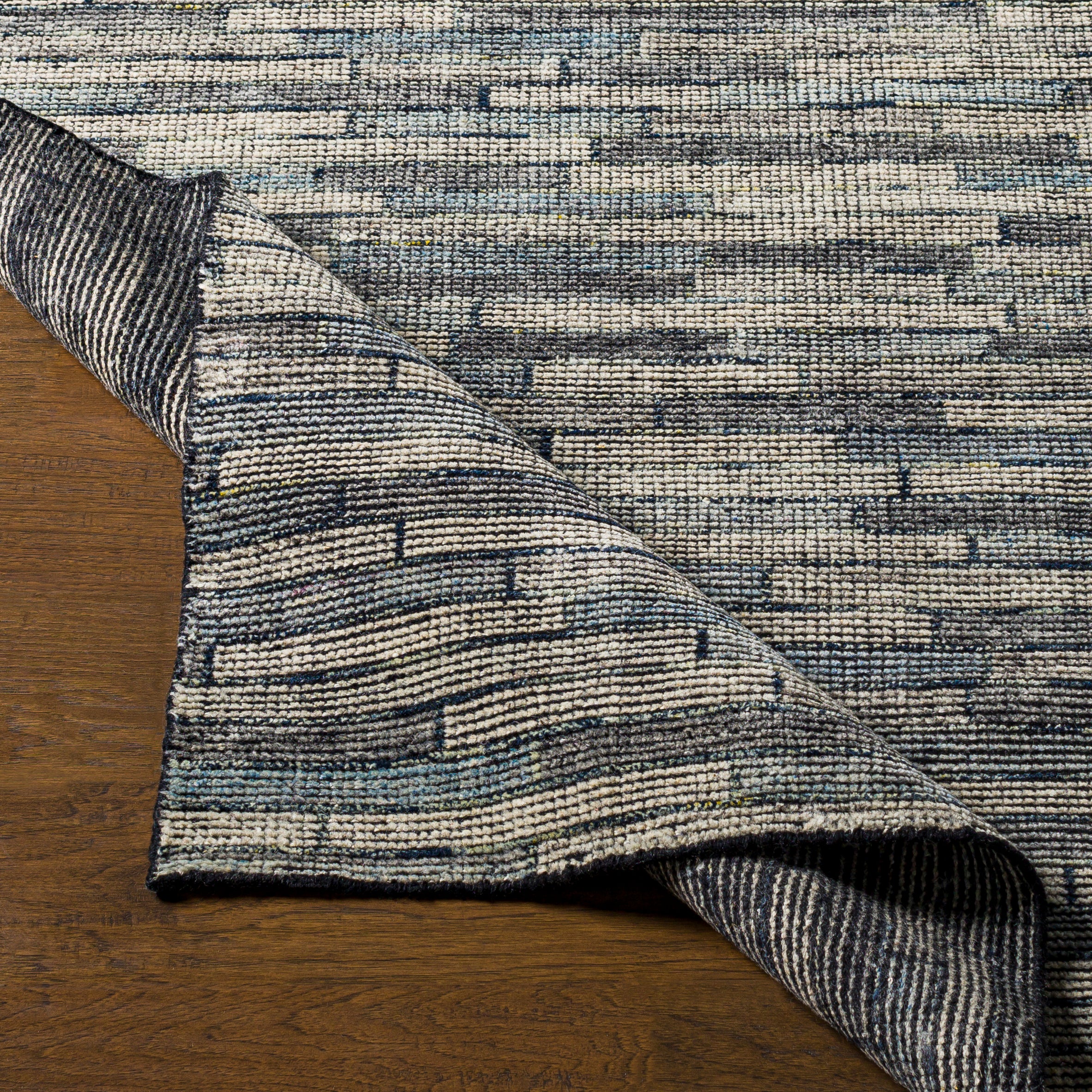 The simplistic yet compelling rugs from the Malaga Collection effortlessly serve as the exemplar representation of modern decor. With their Hand-Knotted construction, these rugs provide a durability that can not be found in other handmade constructions, and boasts the ability to be thoroughly cleaned as it contains no chemicals that react to water, such as glue. Amethyst Home provides interior design, new construction, custom furniture, and area rugs in the Dallas metro area