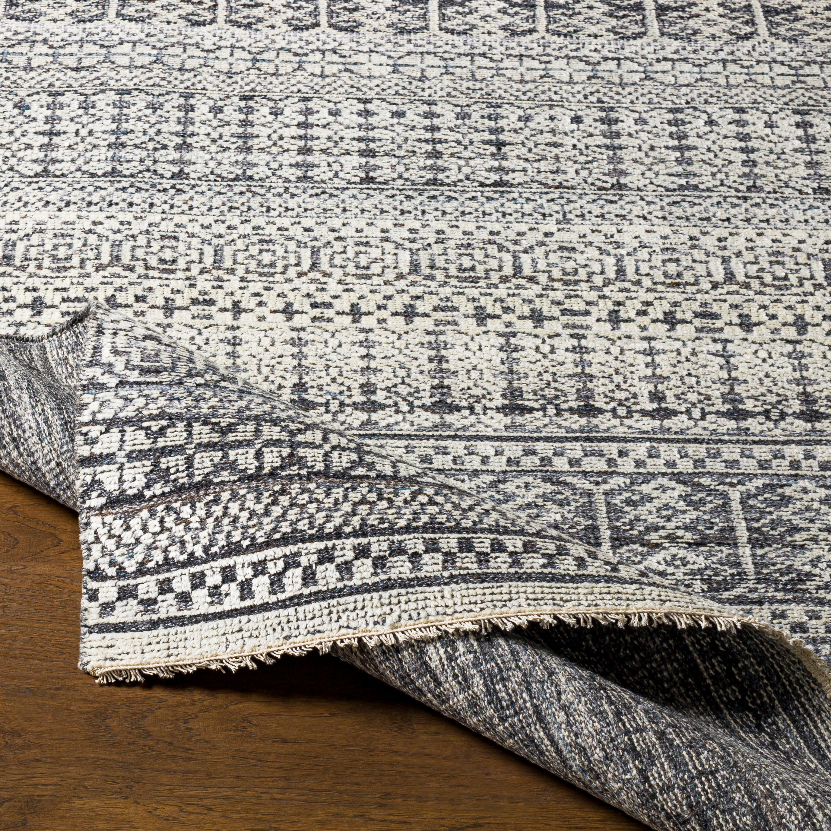 Add an elegant touch to any space with this hand-knotted Nobility Charcoal Rug. Its blend of wool and viscose is ultra soft and smooth, while its timeless ornate motif with modern lines create an exquisite, timeless piece. Enjoy its high-low characteristics and luxurious feel to add a touch of sophistication to your home that fits any lifestyle. Amethyst Home provides interior design, new construction, custom furniture, and area rugs in the Miami metro area.