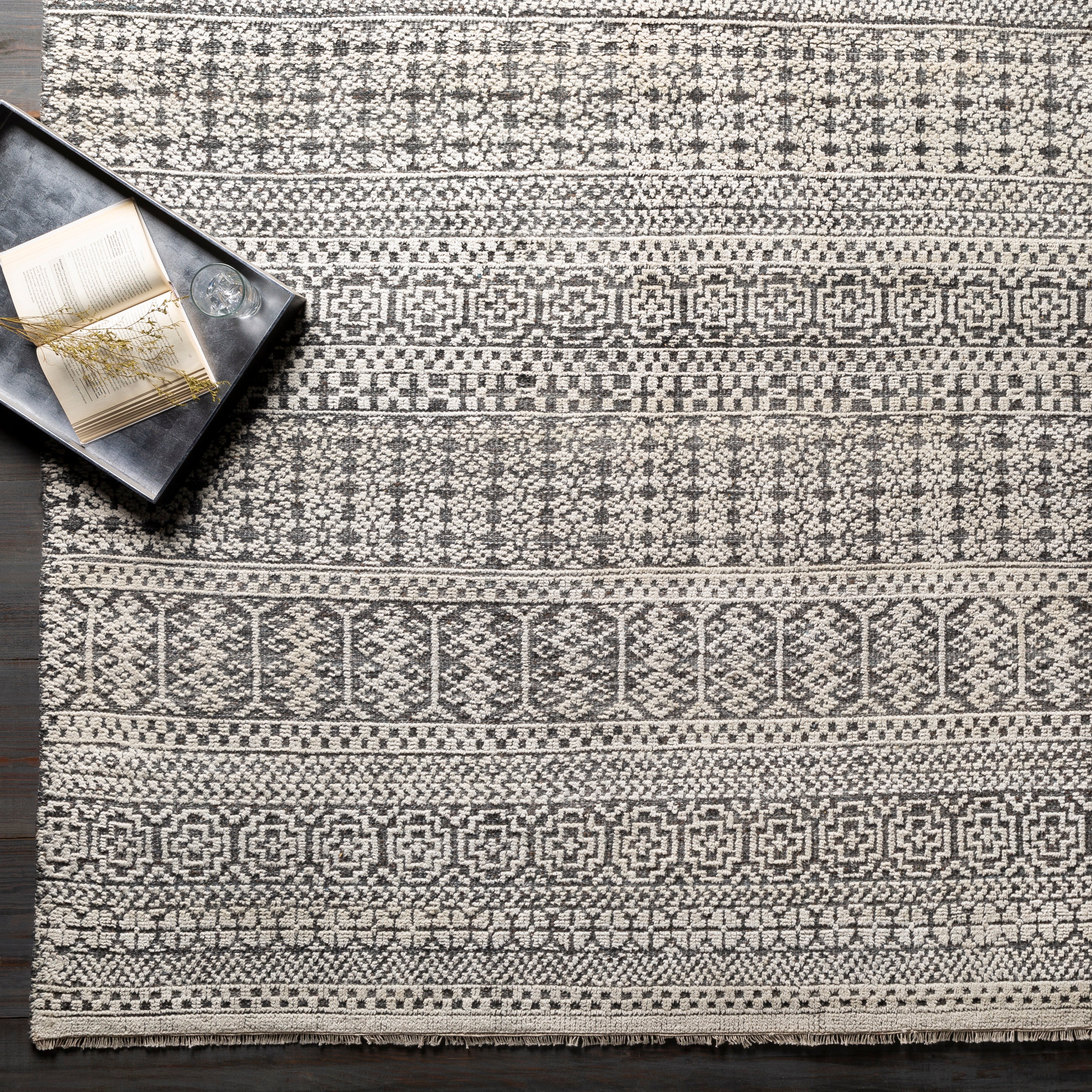 Add an elegant touch to any space with this hand-knotted Nobility Charcoal Rug. Its blend of wool and viscose is ultra soft and smooth, while its timeless ornate motif with modern lines create an exquisite, timeless piece. Enjoy its high-low characteristics and luxurious feel to add a touch of sophistication to your home that fits any lifestyle. Amethyst Home provides interior design, new construction, custom furniture, and area rugs in the Park City metro area.