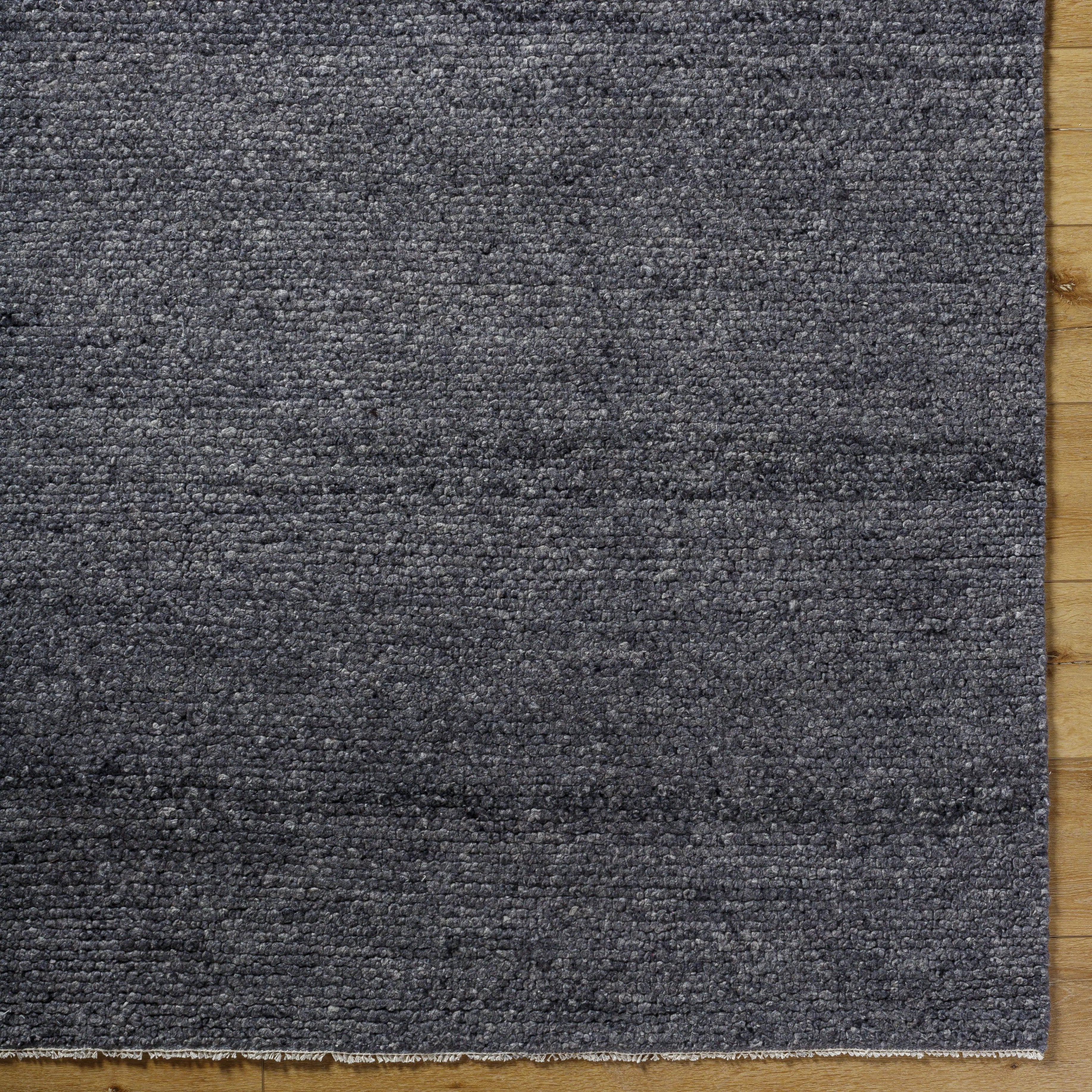 Featuring Wabi Black Hand-Knotted Rug by Surya at Amethyst Home. Experience the beauty of the Wabi Black Hand-Knotted Rug in your home. Crafted with a unique design, this piece will bring a touch of elegance and style to any room. Its luxurious texture and classic black hue will ensure a timeless look for years to come!
100% WoolHand Knotted Low PileThickne. Amethyst Home provides interior design, new home construction design consulting, vintage area rugs, and lighting in the Calabasas metro area.