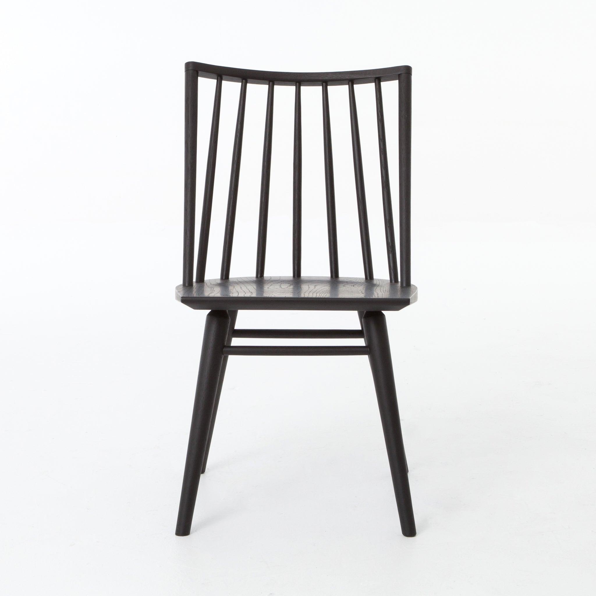 Try a cleaner, more modern take on the traditional Windsor with our Windsor Dining Chair. This tall beauty is wire-brushed to bring out the cathedral grain in the oak, and stained deep black for lovely contrast with more industrial decor. This chair is perfect for a dining room or that special nook in your home.