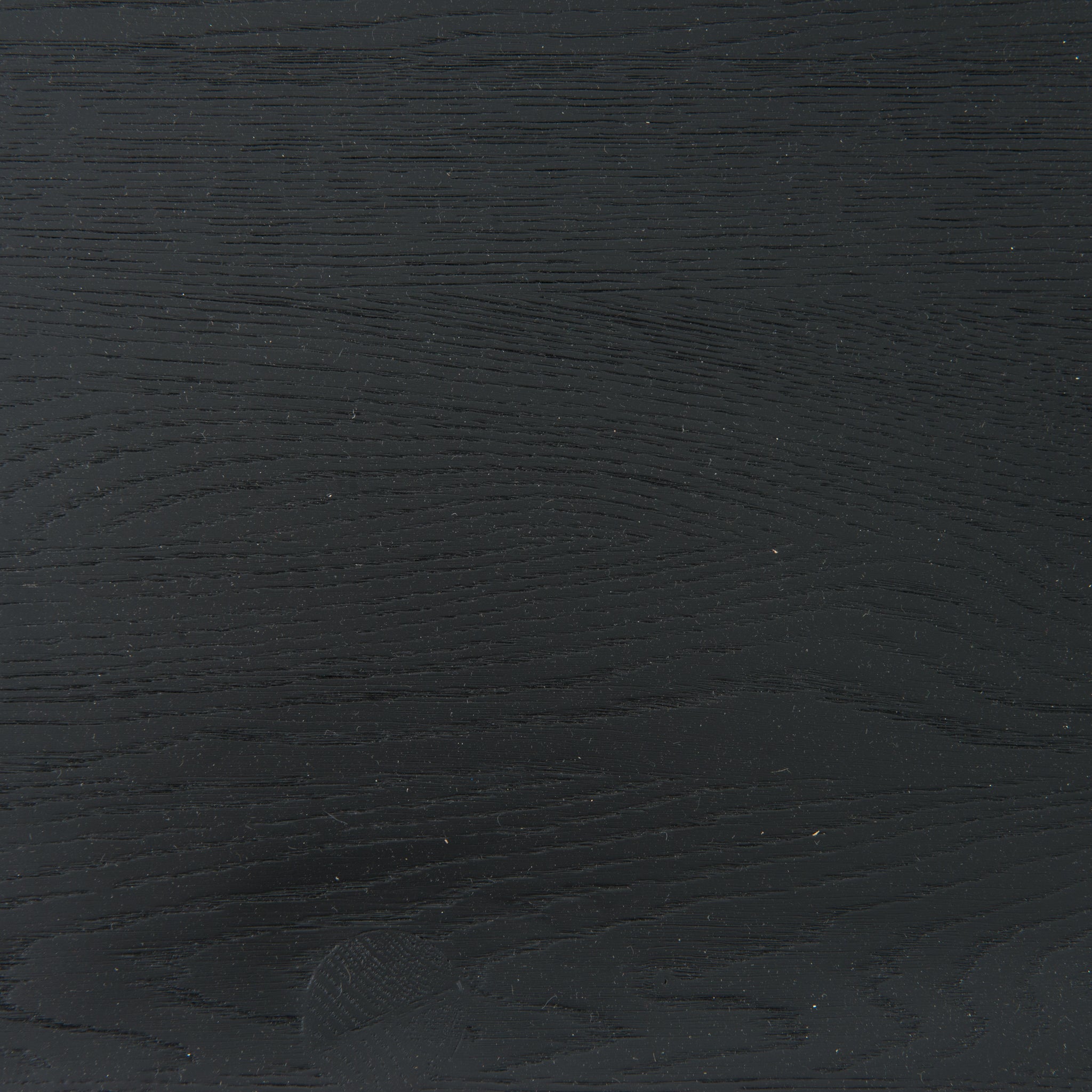 This new take on the mid-century Windsor chair, the Ripley Dining Chair has a bowed, sculptural silhouette. A soft black finish adds movement to the wood by highlighting the natural grain of weathered oak. The chair is perfect for the chic, modern dining room look.