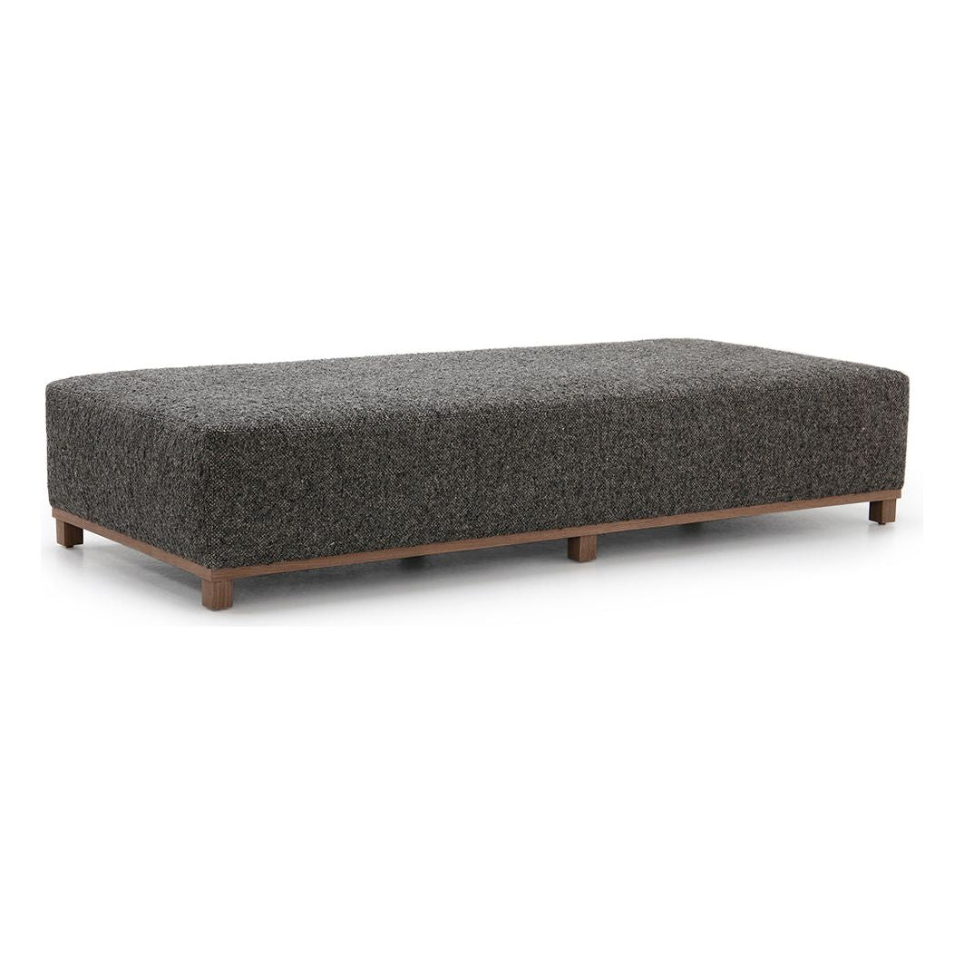 The Elliot Ottoman by Verellen is beautifully shaped and perfect for placing your favorite tray atop or relaxing on after a long day. This is bench-crafted with a sustainably harvested hardwood frame in Verellen's North Carolina atelier. It comes standard with:  • Foam and Fiber Seat Construction • Double Needle • Fabric Covered Ball Button on Top • Available Upholstered Base • Upholstered Only