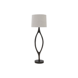The Urbino Walnut Lamp is crafted from sustainably harvested hardwood by Verellen in North Carolina. The unique shape of the body paired with the oatmeal shade complements any room   Base: 16"w x 8"d x 62"h Overall Height: 76"h