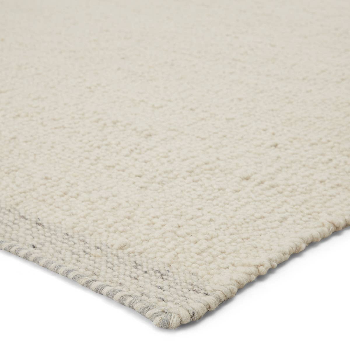 The Vestra Alondra Rug by Jaipur Living, or VST01, is hand-loomed and blended of durable wool and polyester. The light and bright Alondra rug features a textural, ivory design trimmed with flatwoven gray and ivory heathered edges. A perfect choice for your bedroom, living room, or other medium traffic area. 