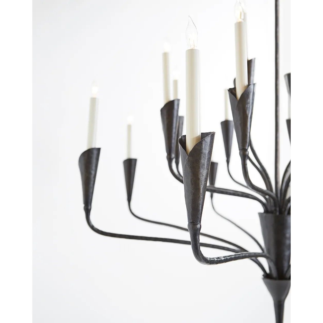 Featuring Aiden Large Chandelier by Visual Comfort at Amethyst Home. Effortlessly combining mid-century and medieval elements, Chapman & Myers' Aiden showcases hammered steel, manipulated with traditional hand-applied techniques to enhance its unexpected textures. The sculptural silhouettes boast details inspired by calla lilies that lend an organic touch. Amethyst Home provides interior design, new home construction design consulting, vintage area rugs, and lighting in the Kansas City metro area.