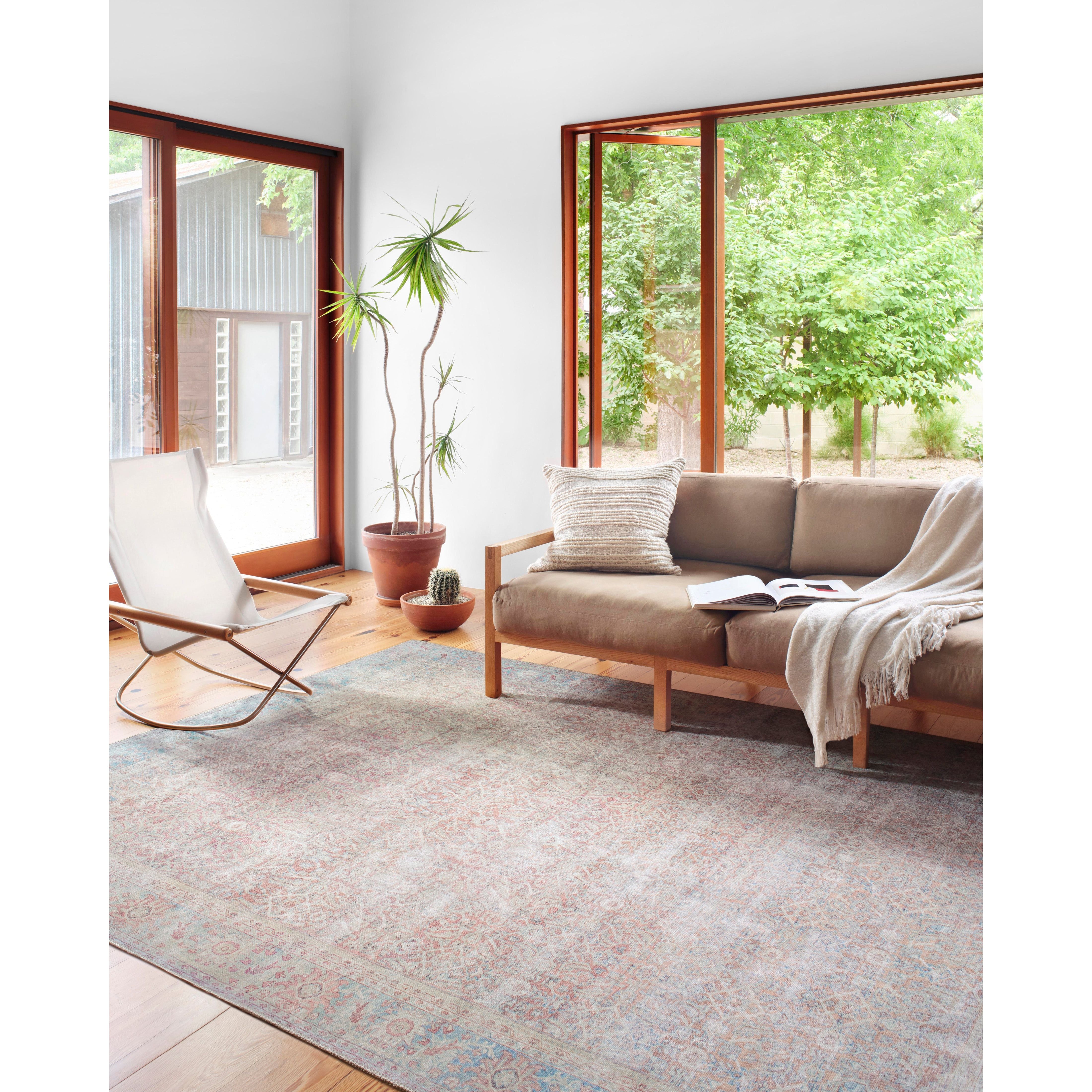 The Wynter Red / Teal area rug showcases a one-of-a-kind vintage or antique area rug look power-loomed of 100% polyester. This rug brings in tones of pink, ivory, and blue. The rug is ideal for high traffic areas due to the rug's durability for living rooms, dining rooms, kitchens, hallways, and entryways.