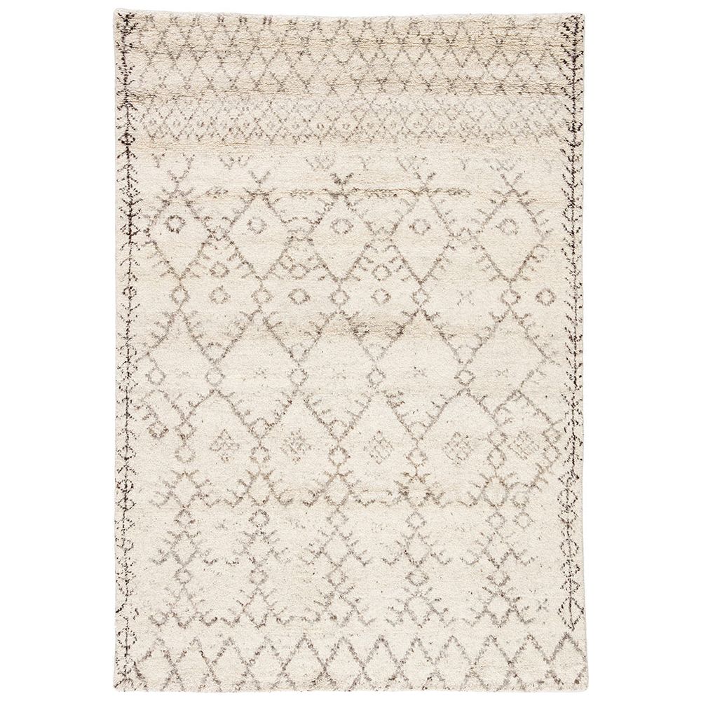 Soft and luxurious in feel, the Zuri Turtledove/Walnut area rug by Jaipur Living is a modern take on a classic Moroccan area rug. The Zuri is made from supple hand-knotted, 100% wool in natural tones of ivory and brown. This rug would be perfect for a living room, bedroom, or hallway in the runner size.