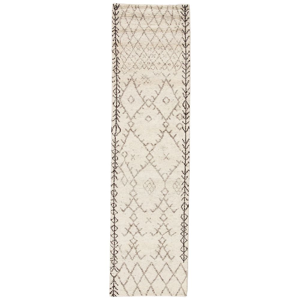 Soft and luxurious in feel, the Zuri Turtledove/Walnut area rug by Jaipur Living is a modern take on a classic Moroccan area rug. The Zuri is made from supple hand-knotted, 100% wool in natural tones of ivory and brown. This rug would be perfect for a living room, bedroom, or hallway in the runner size.