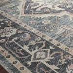 Featuring soft motifs in a carefully curated color palate of black, blue, yellow, and hints of orange, the Hathaway Navy / Multi area rug captures the essence of one-of-a-kind vintage or antique area rug at an attractive price.