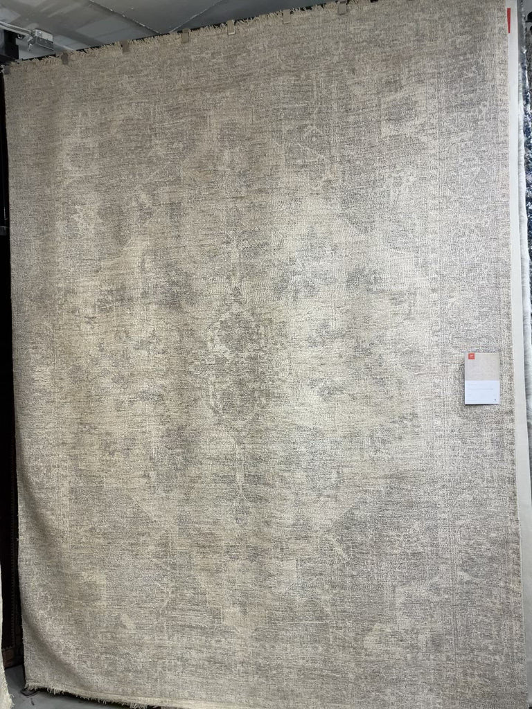 Hand-woven by skilled artisans, the Priya Ivory / Grey Area Rug from Loloi offers beautiful tonal designs accentuated by a carefully curated color palette. Delicate yet strong, Priya is an instant classic made for today's home.  Hand Woven 51% Cotton | 29% Polyester | 12% Viscose | 8% Wool PRY-04 Ivory/Grey Colors: Ivory, Grey