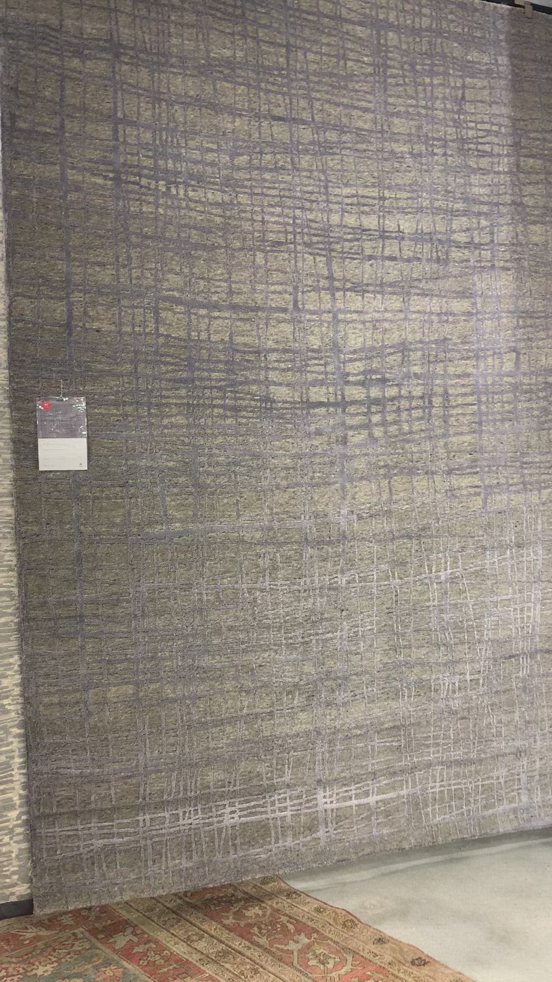 Load video: The Atlas Sage / Stone Area Rug by Loloi, or ATL-02, showcases striking contemporary patterns with a sophisticated color palette. Bold yet approachable, Atlas&#39; muted linear designs create a sense of refined movement. Hand Knotted. Wool | Nylon
