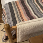 Bring a cozy hygge vibe to the bedroom with this textured Bowen Bed. Framed by light-finished solid oak, a sling-style bed features faux shearling head and foot boards -- sure to elevate any bedroom.   Queen Overall Dimensions: 64.25"w x 87.25"d x 48.00"h King Overall Dimensions: 80.25"w x 88.50"d x 48.00"h