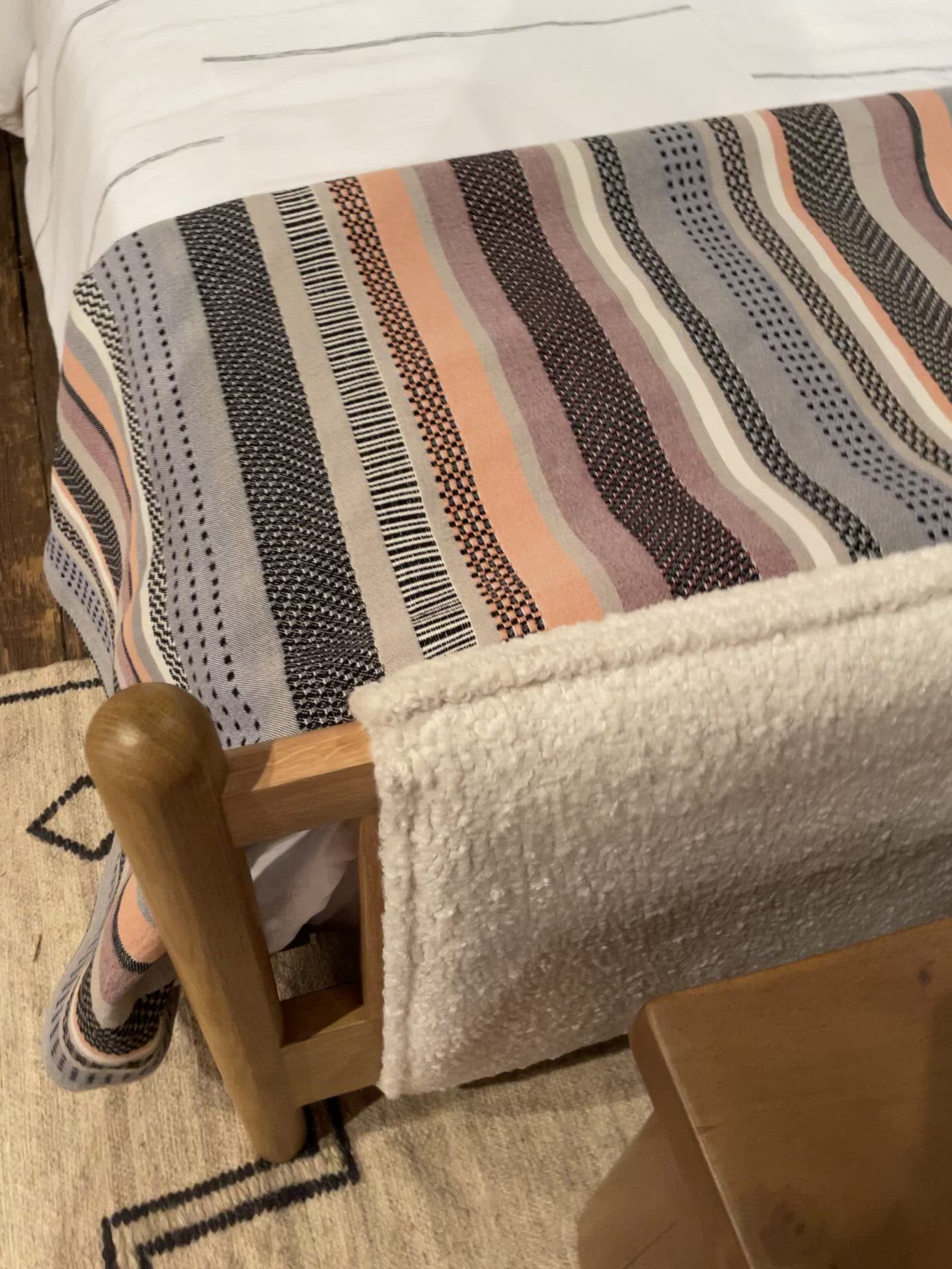 Load video: Bring a cozy hygge vibe to the bedroom with this textured Bowen Bed. Framed by light-finished solid oak, a sling-style bed features faux shearling head and foot boards -- sure to elevate any bedroom.   Queen Overall Dimensions: 64.25&quot;w x 87.25&quot;d x 48.00&quot;h King Overall Dimensions: 80.25&quot;w x 88.50&quot;d x 48.00&quot;h