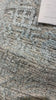 The Idris Spa area rug from Loloi is meticulously hand-knotted of viscose and wool. You will love this rug because the rug is:  Perfect for entryways, living rooms, and bedrooms Easy to clean and maintain Gorgeous with the intricate pattern and patina Warms up any room with the high / low pile Hand-Knotted 70% Viscose | 30% Wool ID-03 Spa