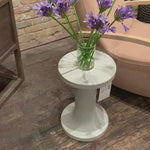 Made from white-finished cast aluminum with high texture, this dramatically tapered Gino End Table - Matte White makes for a stylish spot to keep a favorite book or drink within reach. Tabletop surfaces may vary in texture and dimples, reflective of materials' organic roots.  Overall Dimensions: 13.00"w x 13.00"d x 20.00"h