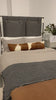 The black straps on this Leigh San Remo Ash Upholstered Bed give any bedroom a stylish, modern look. Amethyst Home provides interior design, new home construction design consulting, vintage area rugs, and lighting in the Salt Lake City metro area.