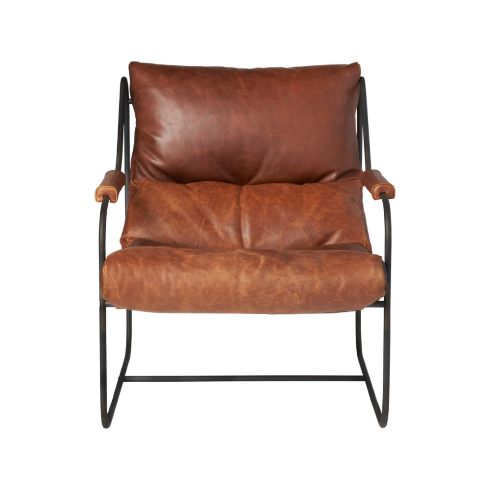 Like "sitting in an American baseball glove" -- the Brando Leather Chair from Cisco Brothers was love at first sit in this unique chair! We compare the feel to sitting in a hammock. As shown in Spur Terracotta in a Grade 500 leather.  Size: 27"w x 36"d x 32"h Seat space: 25"w x 19"d x 17.5"h