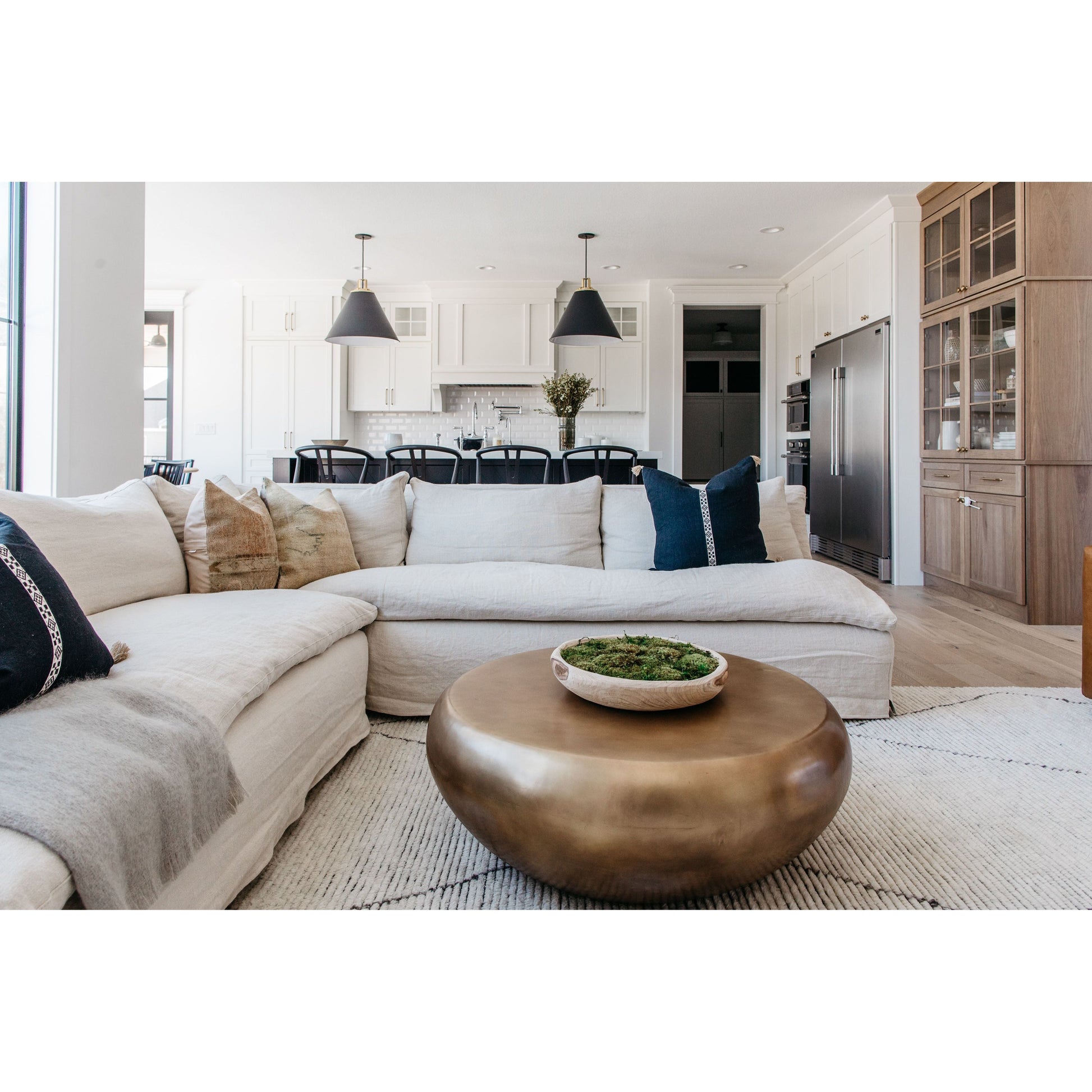 A casual, slipcovered chunky linen sectional by Cisco Brothers, the Laguna 2pc Sectional is the ultimate in casual luxury.  A down-filled seat cushion is supported by springs in a gentle, resting position.  Pair with a one-of-a-kind statement rug for a signature look. Shown in Otis White 100% linen.  Overall dimensions: 113"w x 31"h x 113"d Seat Space: 96"w x 96"d x 16"h