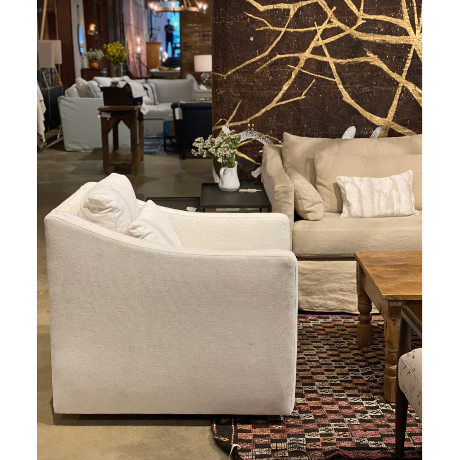 The Rebecca Chair by Cisco Brothers has a stunning silhouette draped in a graceful slip skirt with a neat kick-pleat detail. With a lumbar pillow for extra comfort, this tranquil chair will bring relaxation and ease into your home. Photographed in Denim White. Amethyst Home provides interior design, new home construction design consulting, vintage area rugs, and lighting in the Miami metro area.