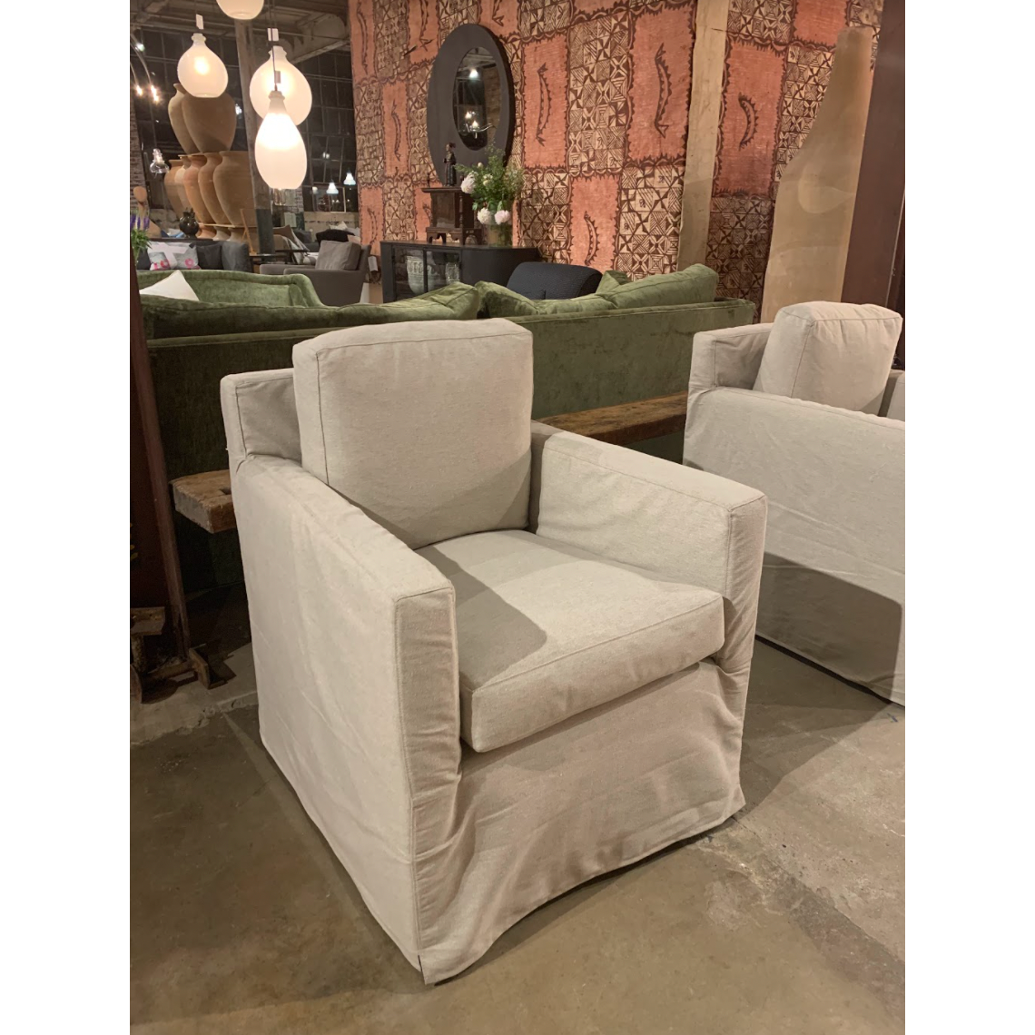 The Louis Chair by Cisco Brothers has an engaging profile and a sheltering, narrow seat. This design combines modern and coastal aesthetics with clean lines, a straight skirt, and a subtle 2" slit.A classic style with a scale that suits any living room or lounge area. Photographed in Logan Oatmeal. Lifestyle in Logan Grey. Amethyst Home provides interior design, new home construction design consulting, vintage area rugs, and lighting in the Park City metro area.