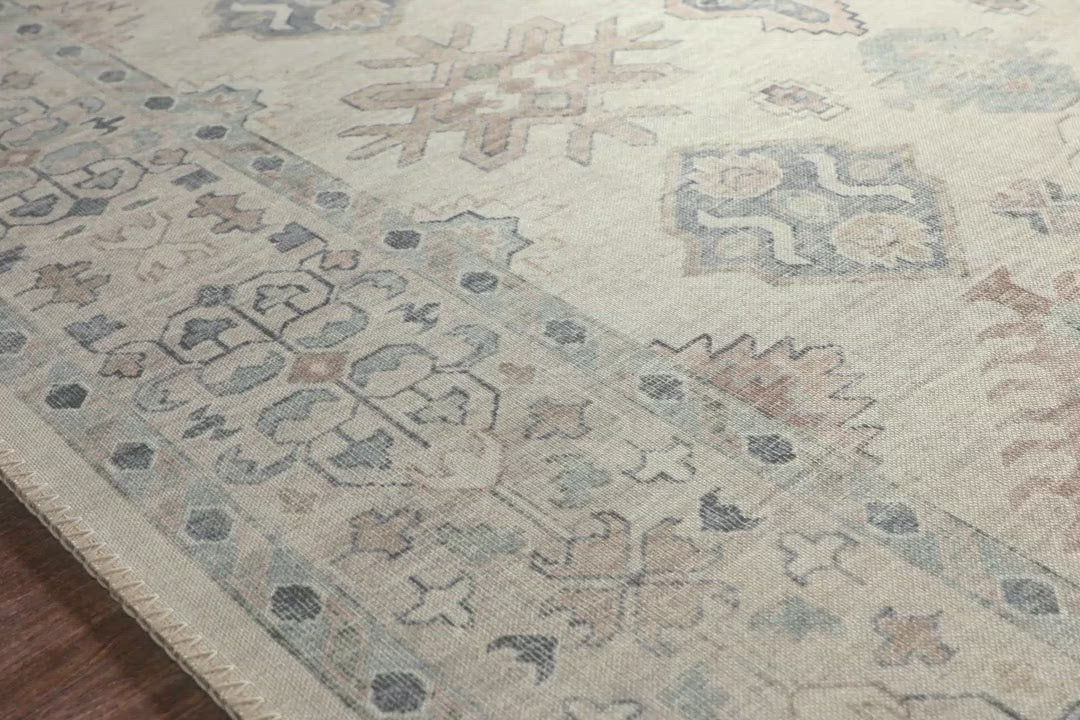 Load video: Featuring soft motifs in a carefully curated color palate of beige, ivory, and hints of black, the Hathaway Beige / Multi area rug captures the essence of one-of-a-kind vintage or antique area rug at an attractive price.