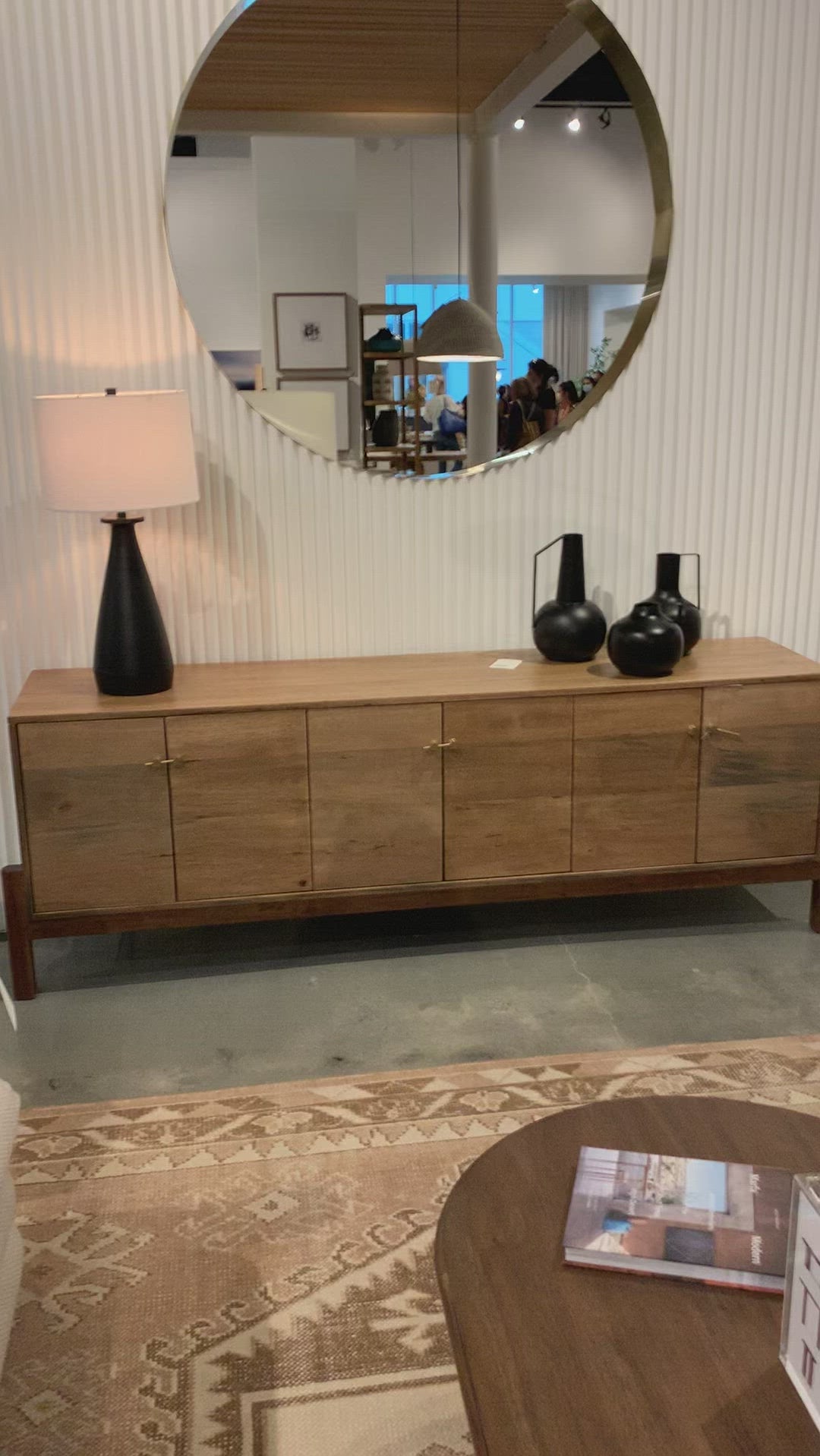 We love mid-century feel to this Reza Media Console - Smoked Honey. Finished in a light, smoked honey, a clean-lined parawood console sits in an arched cradle base of toasted acacia, for fresh contrast. Twist-lock metal hardware adds a clever finishing touch. Rear cutouts for media cord management. Amethyst Home provides interior design, new home construction design consulting, vintage area rugs, and lighting in the Los Angeles metro area.
