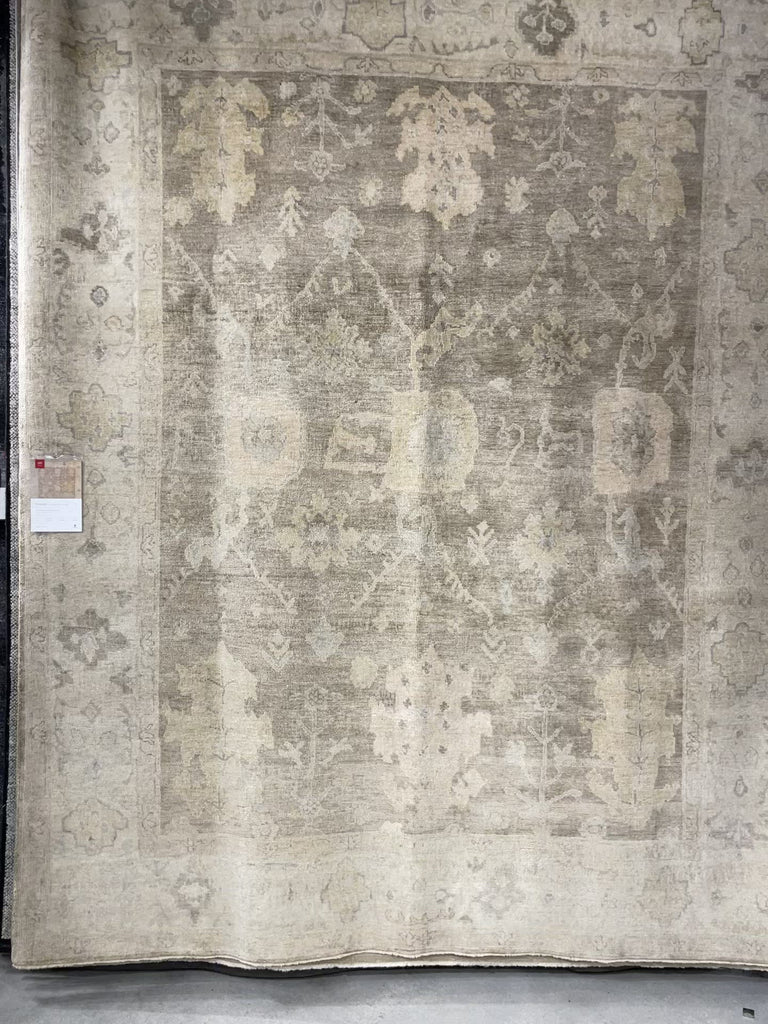 Hand knotted of 100% wool by skilled artisans, the Loloi Vincent Moss Gray /Stone Area Rug, or VC-02, offers the look of a well-worn antique rug in a modern day color palette. Each exquisite piece undergoes a weeks-long antique washing process which fades the pattern and color beautifully. 