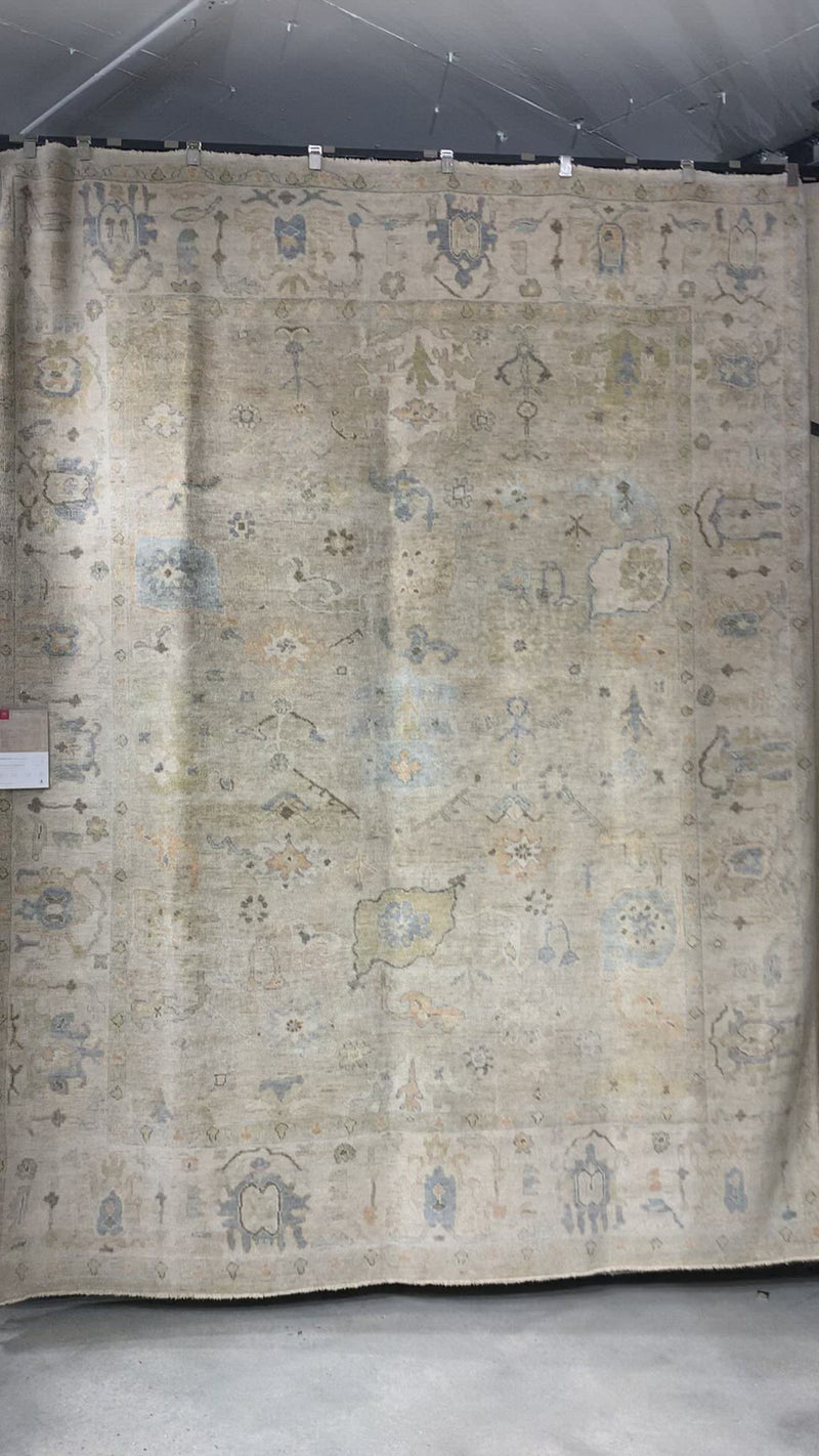Hand knotted of 100% wool by skilled artisans, the Loloi Vincent Dune / Stone Area Rug, or VC-03, offers the look of a well-worn antique rug in a modern day color palette. Each exquisite piece undergoes a weeks-long antique washing process which fades the pattern and color beautifully. 