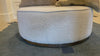 This round ottoman of textural cream boucle can be placed just about anywhere, bringing with it a hip retro vibe.  Overall Dimensions: 36"w x 36"d x 14.5"h