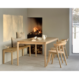 This Oak Bok Bench features an airy shape with rock-solid construction,  making this piece a timeless and remarkable design to enjoy for years to come. Pair with a dining table or stand-alone against a wall, hallway, or end of the bed!  Material: Oak Finish: Oiled