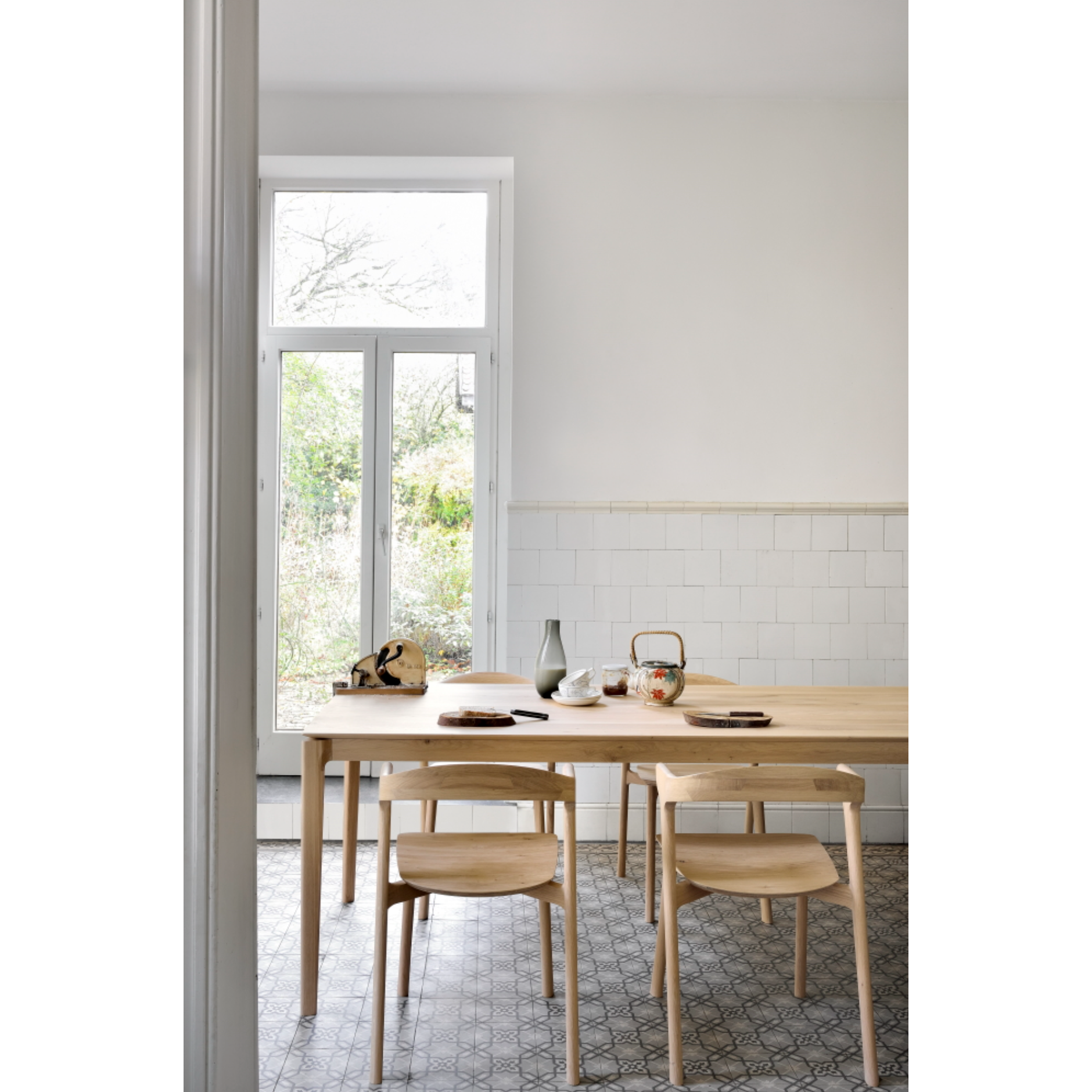 This Oak Bok Dining Chair features an airy shape with rock-solid construction,  making this piece a timeless and remarkable design to enjoy for years to come. Pair with a dining table or stand-alone against a wall, hallway, or end of the bed! Designed by Alain can Havre  Dimensions: 20"w x 21.5"d x 30"h  Weight: 20 lbs  Seat Height: 18"  Material: Oak, 100% solid wood Finish: Oiled