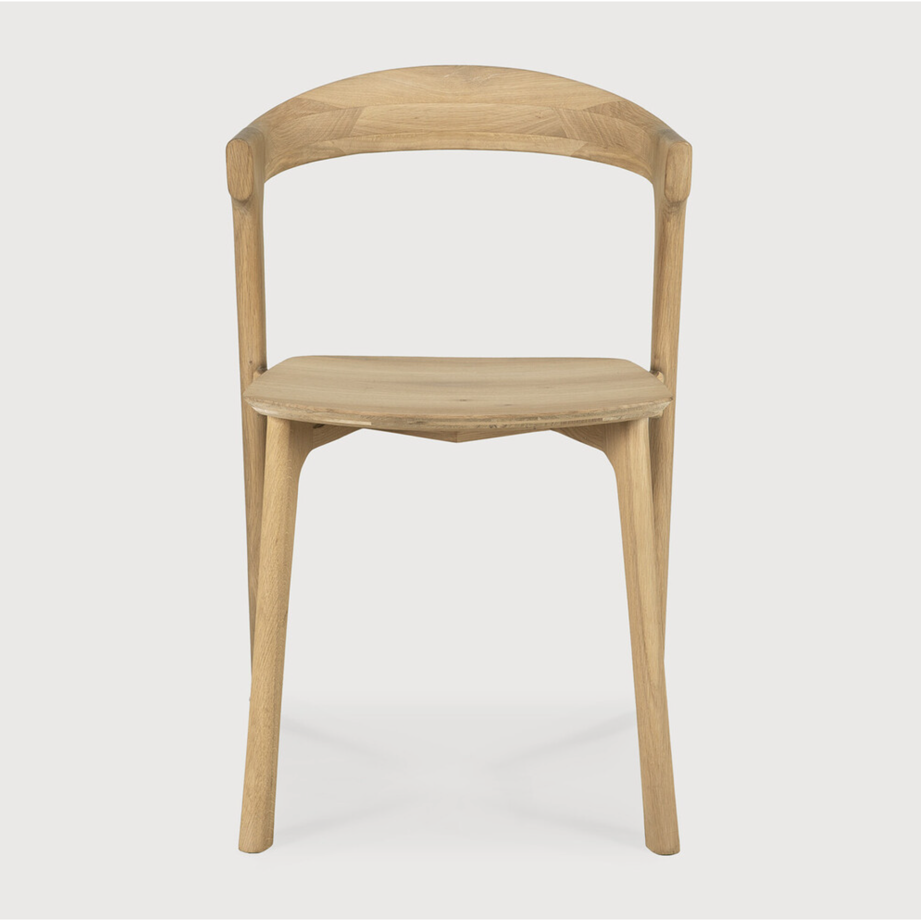 This Oak Bok Dining Chair features an airy shape with rock-solid construction,  making this piece a timeless and remarkable design to enjoy for years to come. Pair with a dining table or stand-alone against a wall, hallway, or end of the bed! Designed by Alain can Havre  Dimensions: 20"w x 21.5"d x 30"h  Weight: 20 lbs  Seat Height: 18"  Material: Oak, 100% solid wood Finish: Oiled