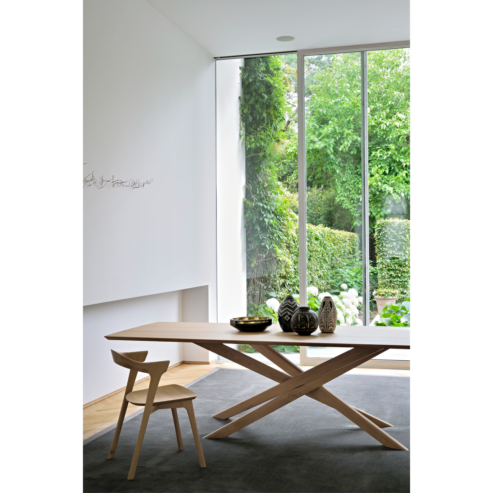 This Oak Bok Dining Chair features an airy shape with rock-solid construction, making this piece a timeless and remarkable design to enjoy for years to come. Pair with a dining table or stand-alone against a wall, hallway, or end of the bed! Designed by Alain can Havre Dimensions: 20"w x 21.5"d x 30"h Weight: 20 lbs Seat Height: 18" Material: Oak, 100% solid wood Finish: Oiled