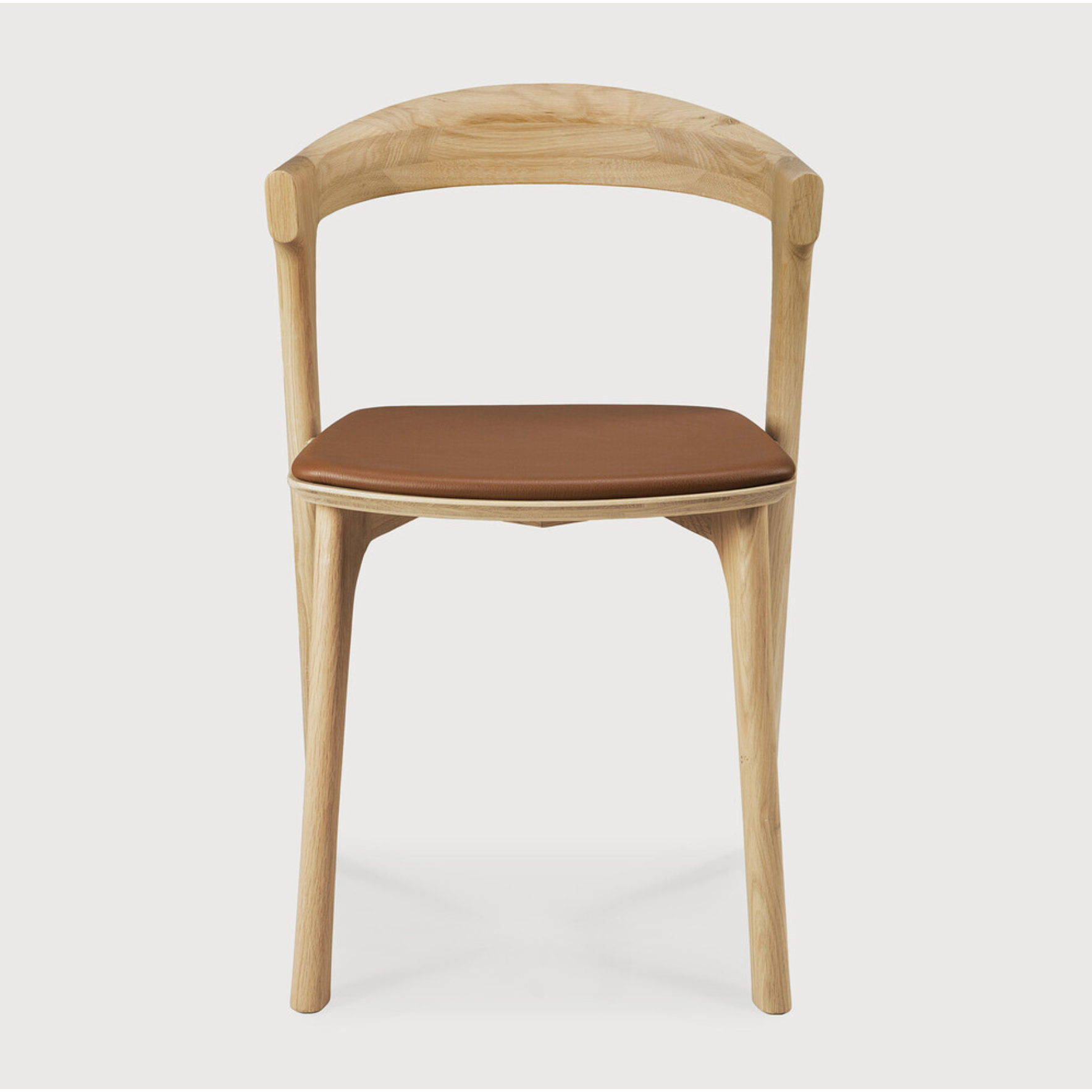 This Oak Bok Dining Chair features an airy shape with rock-solid construction,  making this piece a timeless and remarkable design to enjoy for years to come. Pair with a dining table or stand-alone against a wall, hallway, or end of the bed! Designed by Alain can Havre  Dimensions: 20"w x 21.5"d x 30"h  Weight: 15 lbs  Seat Height: 19"  Material: Oak, 100% solid wood Finish: Varnished