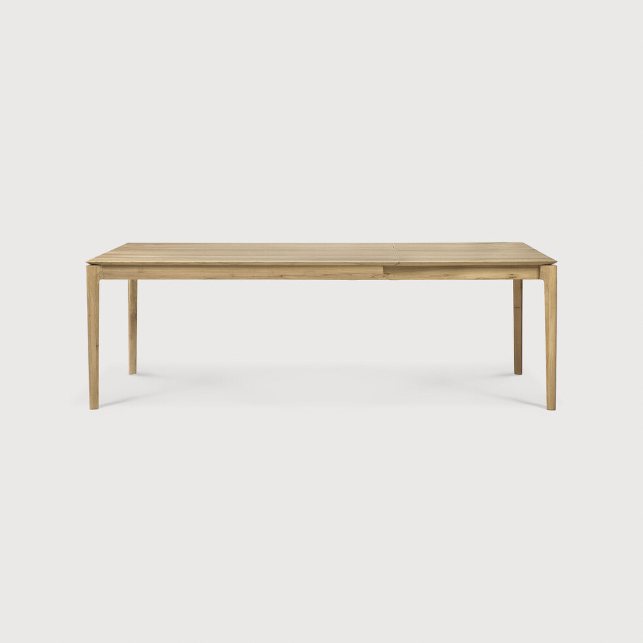 This Oak Bok Extendable Dining Table is perfect for families who want extra space when their kids, extended family, or guests come to celebrate! Its airy shape yet rock solid construction make this piece a timeless and remarkable design to enjoy for years to come.  Material: Oak, 100% Solid Wood Finish: Oiled