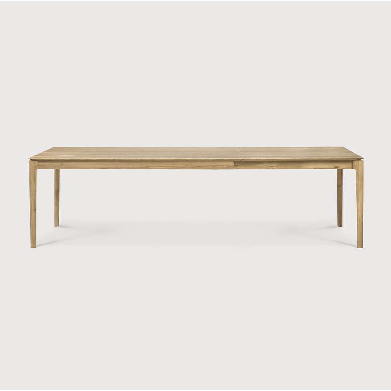 This Oak Bok Extendable Dining Table is perfect for families who want extra space when their kids, extended family, or guests come to celebrate! Its airy shape yet rock solid construction make this piece a timeless and remarkable design to enjoy for years to come.  Material: Oak, 100% Solid Wood Finish: Oiled