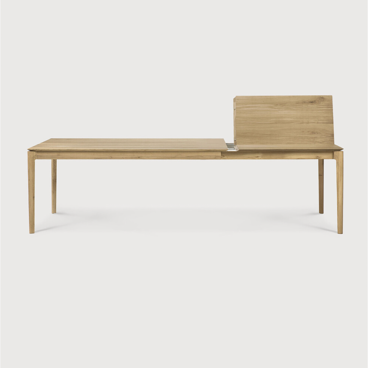 This Oak Bok Extendable Dining Table is perfect for families who want extra space when their kids, extended family, or guests come to celebrate! Its airy shape yet rock solid construction make this piece a timeless and remarkable design to enjoy for years to come.  Material: Oak, 100% Solid Wood Finish: Oiled