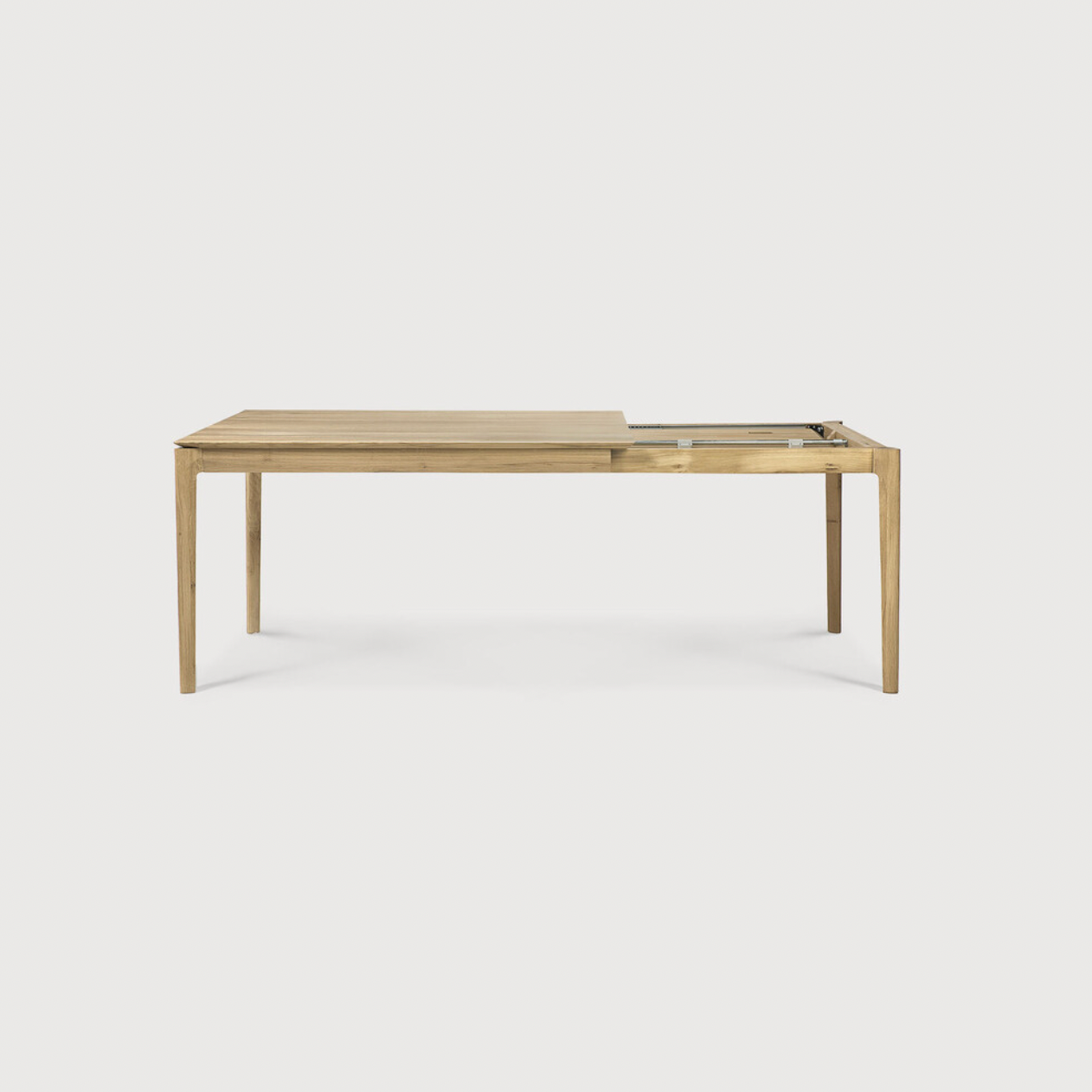 This Oak Bok Extendable Dining Table is perfect for families who want extra space when their kids, extended family, or guests come to celebrate! Its airy shape yet rock solid construction make this piece a timeless and remarkable design to enjoy for years to come.  Material: Oak, 100% Solid Wood Finish: Oiled
